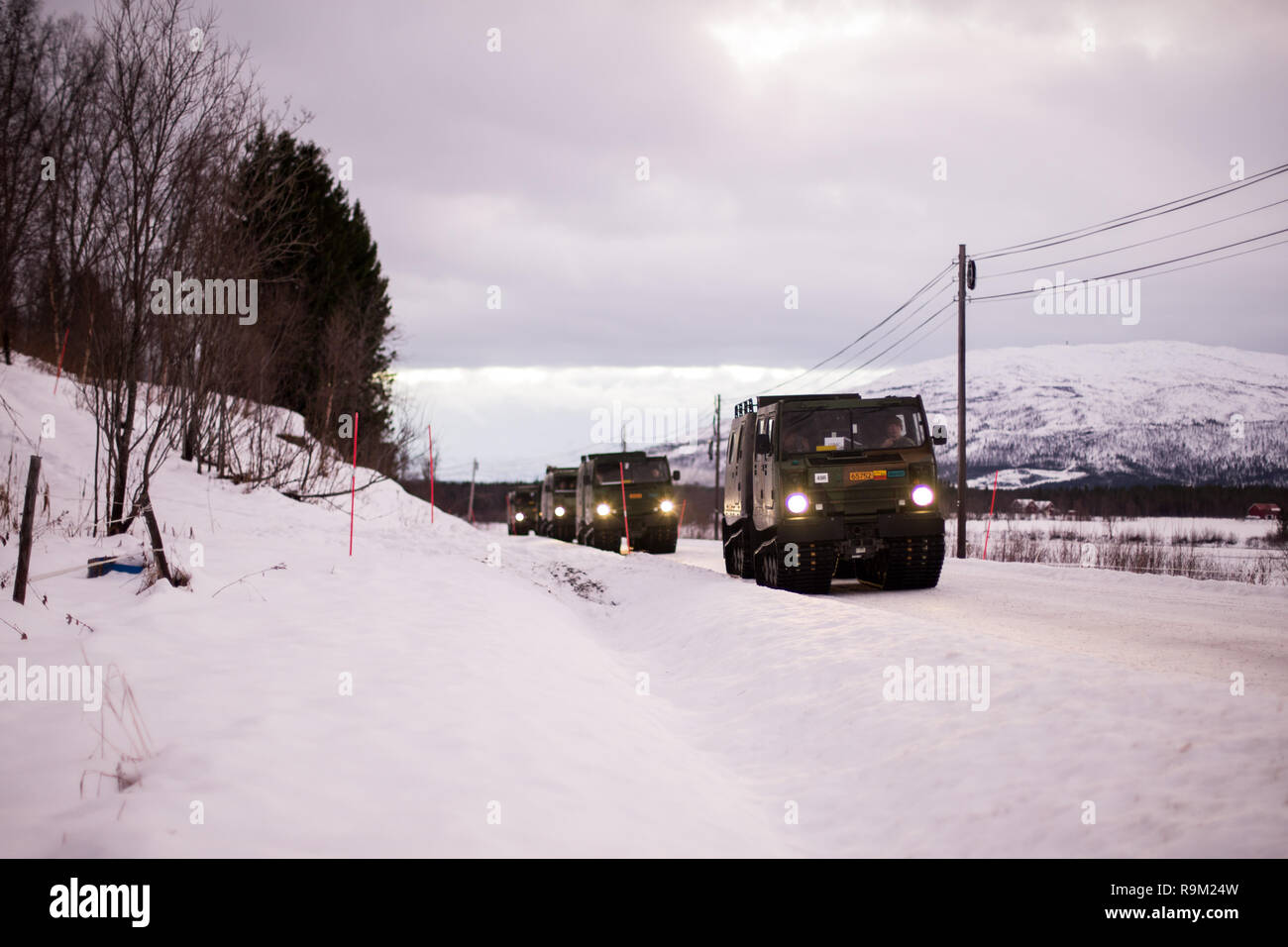 U.S. Marines with Marine Rotational Force-Europe (MRF-E) 19.1 convoy to a training site during a Bandvagn 206 (BV206) driver’s course in Setermoen, Norway, Dec. 14, 2018. The course consisted of Marines learning the safety and maintenance of the BV206 as well as on- and off-road, low-friction, and unknown-terrain driving. (U.S. Marine Corps photo by Cpl. Nghia Tran) Stock Photo