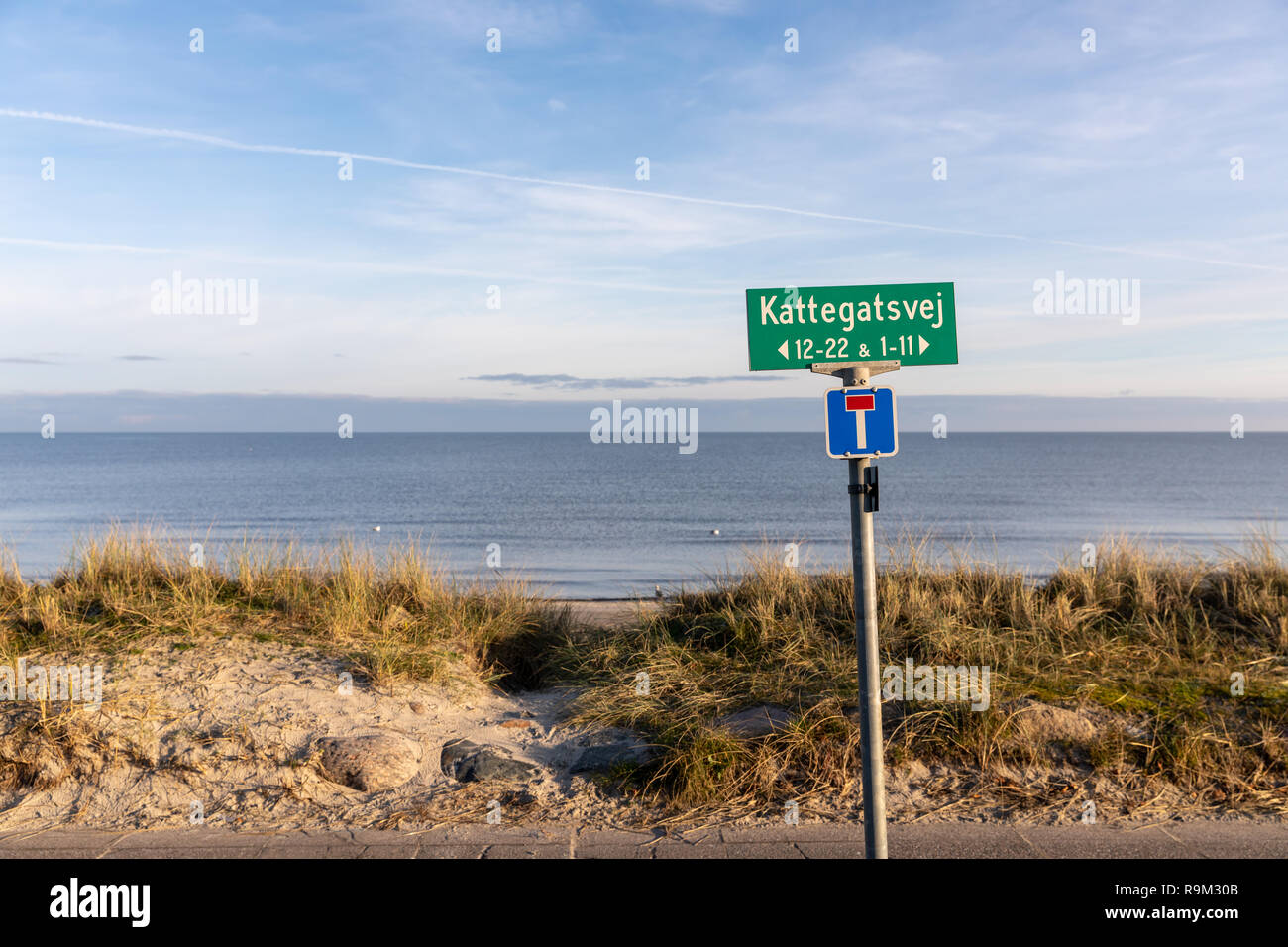 Kattegatsvej, street name sign by the beach, with the sea (Kattegat) in the background; Saeby, Denmark Stock Photo