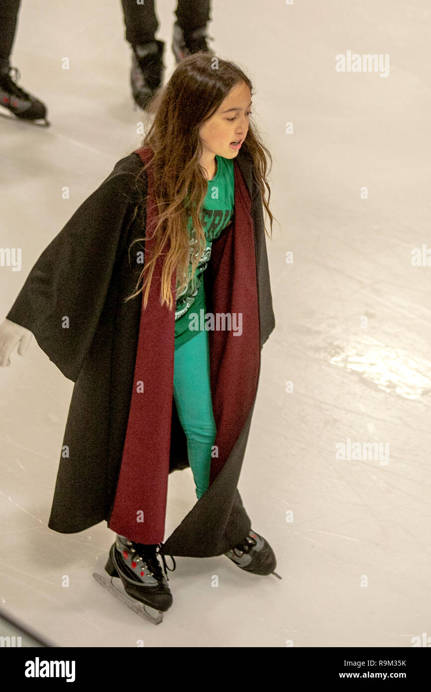 Wearing wizard robes, a Harry Potter book devotee participates in an ice skating event in honor of author J.K. Rowling in Anaheim, CA. Stock Photo