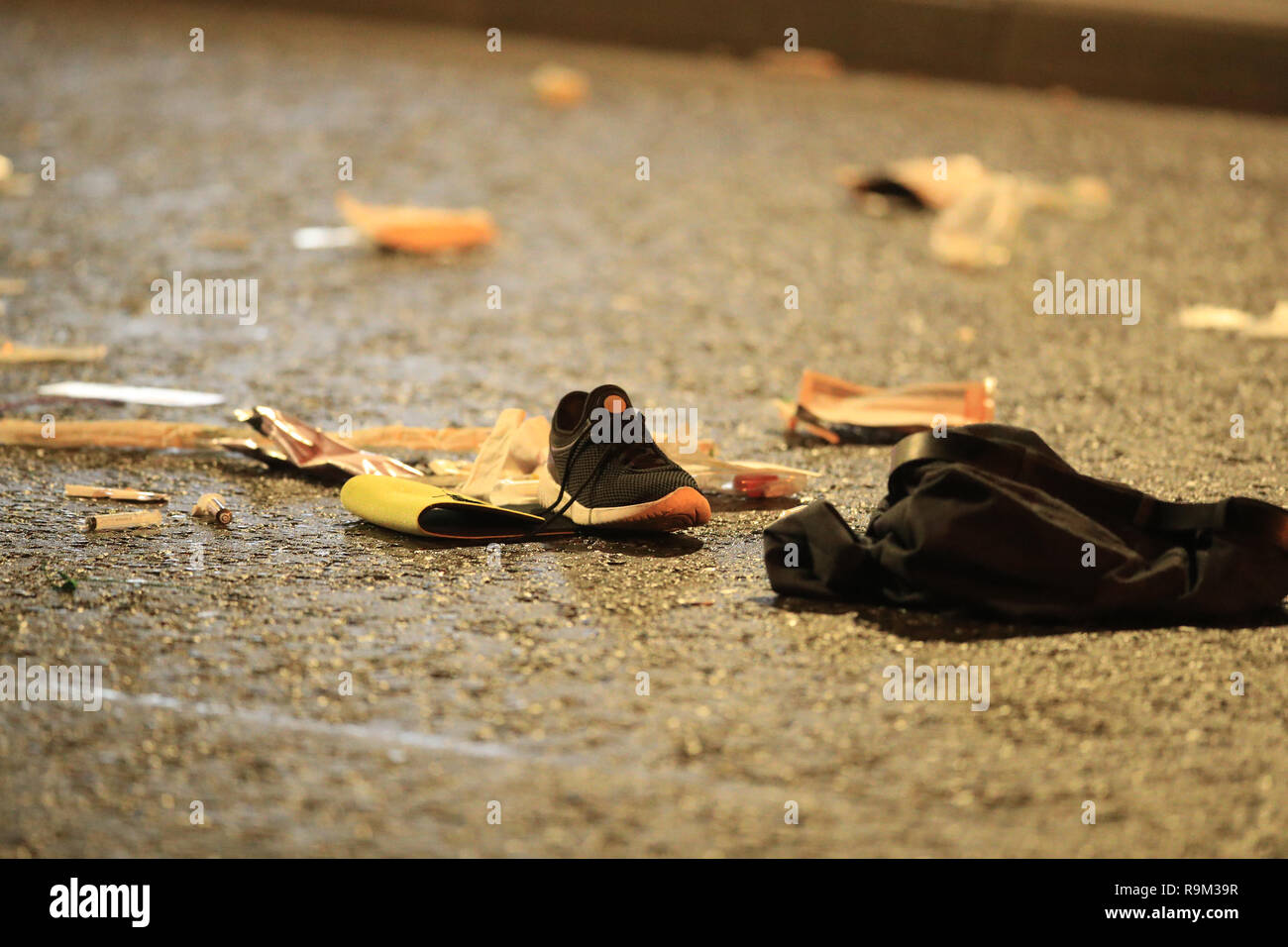 A shoe, clothing and medical equipment lie on the road at the scene of an accident on Scotland Road near the Wallasey Tunnel in Liverpool where a man has died after being hit by a police car on Christmas night. Stock Photo