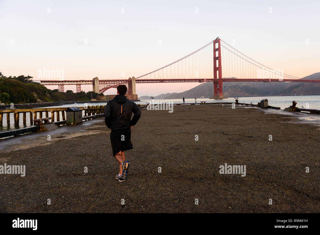 SAN FRANCISCO, USA OCTOBER 12, 2018 A man running at sunrise on the