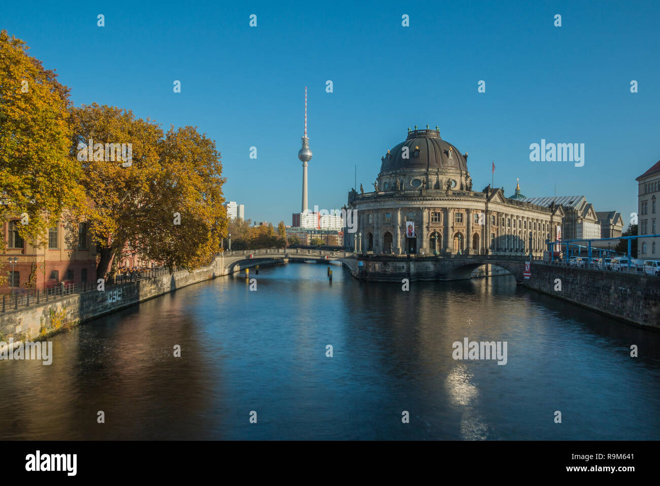 Berlin cityscape with museum island and the river Spree in autumn. In the background the TV tower is visible in the blue sky on sunny day Stock Photo