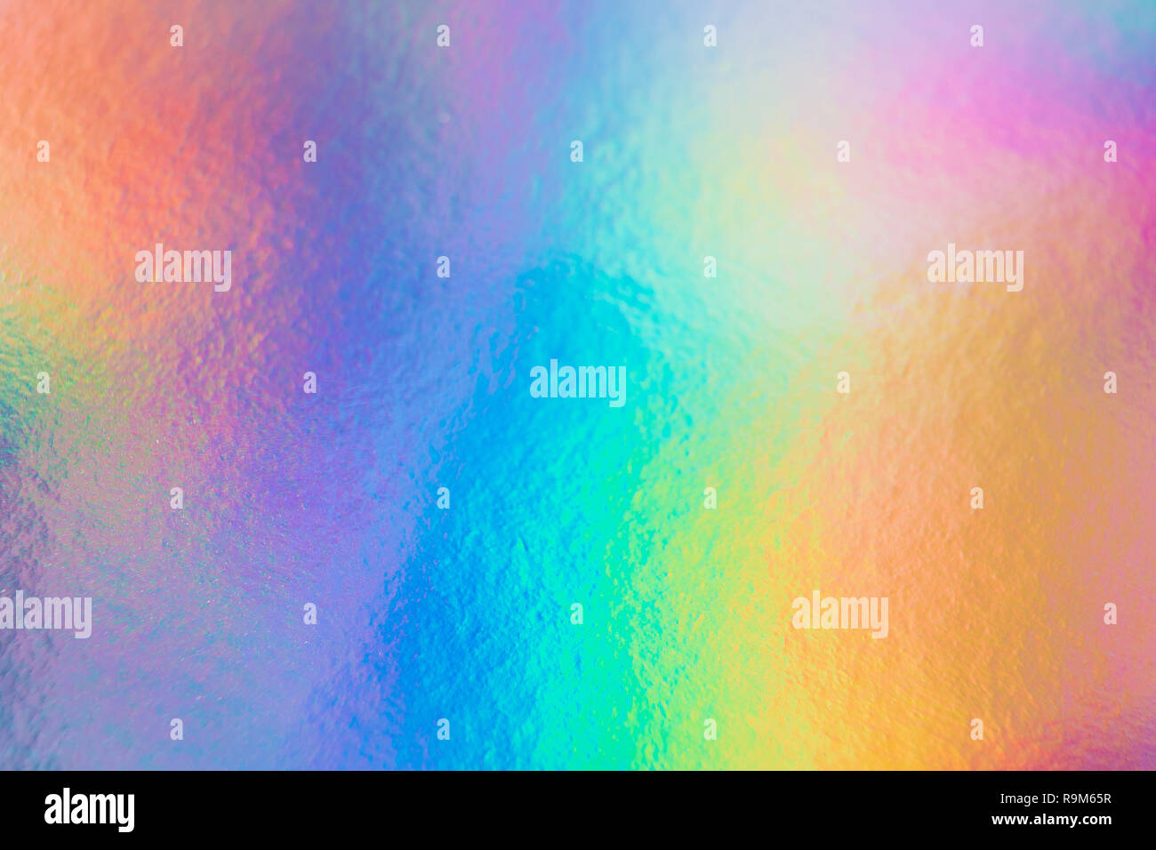 colorful holographic paper with rainbow lights. Stock Photo