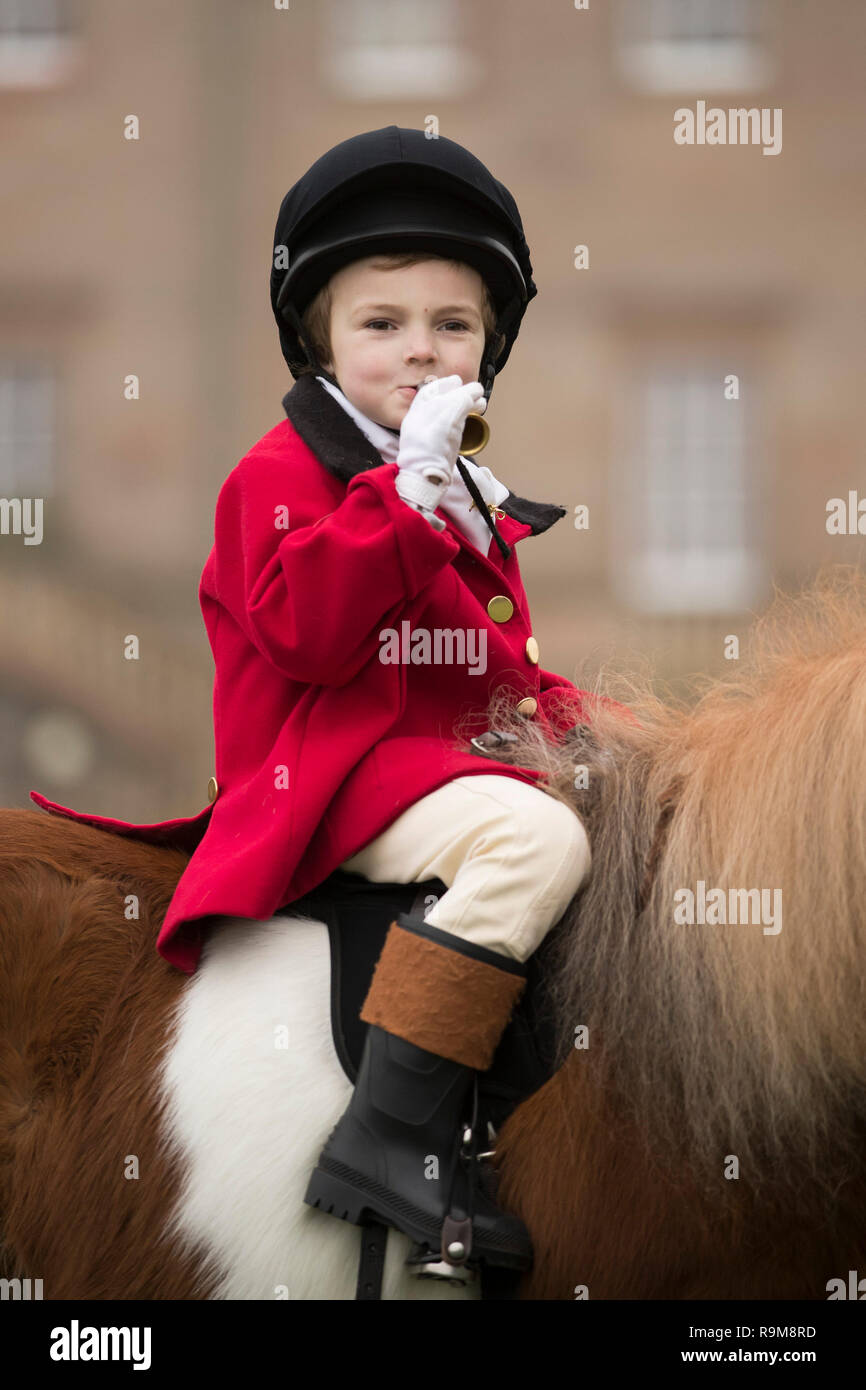 Henley Mills, 5, atop a Shetland pony as members of the Albrighton & Woodland Hunt gather at Hagley Hall near Stourbidge in the West Midlands for the Boxing Day hunt. Stock Photo