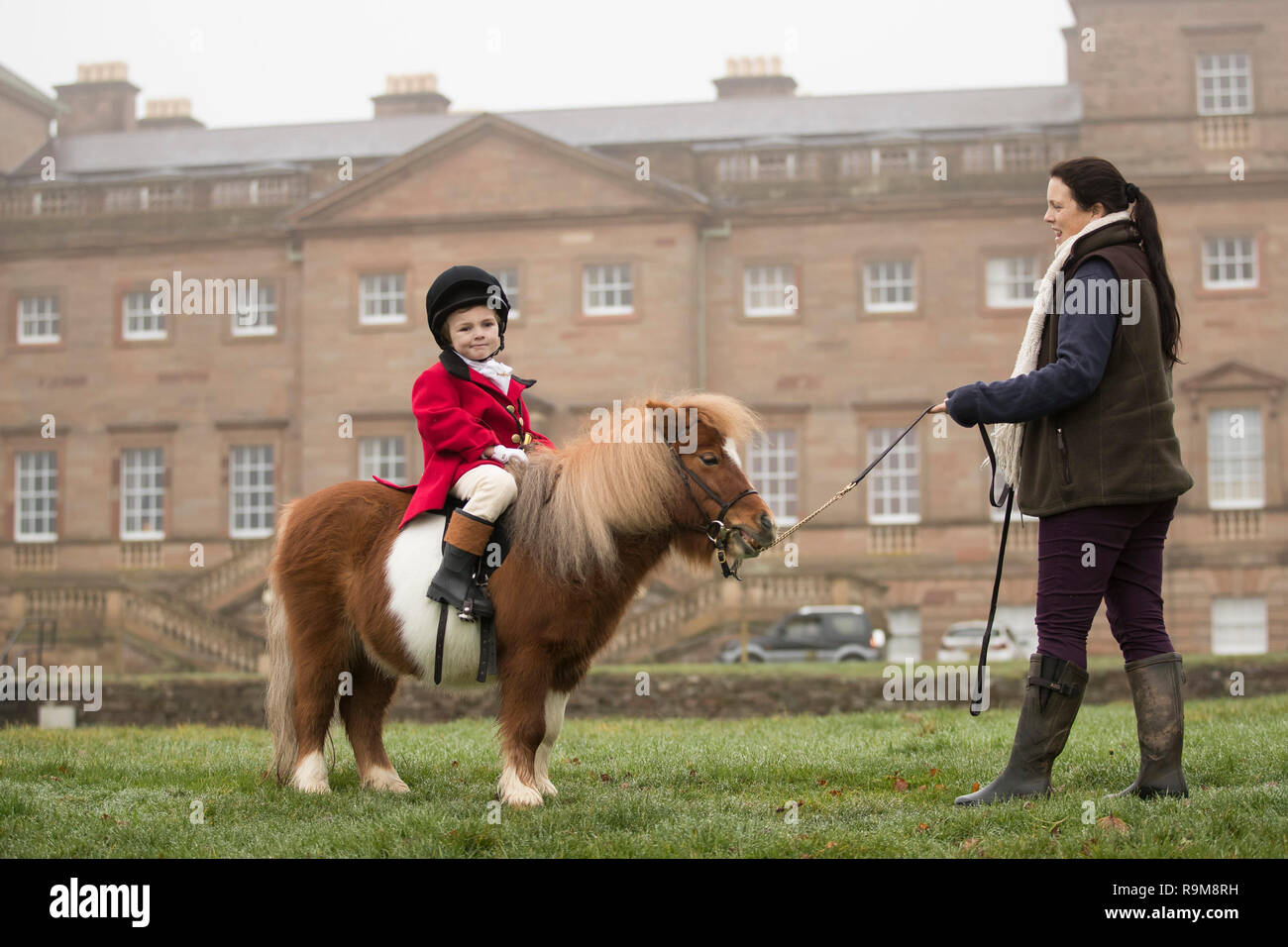 Henley Mills, 5, atop a Shetland pony as members of the Albrighton & Woodland Hunt gather at Hagley Hall near Stourbidge in the West Midlands for the boxing Day hunt. Stock Photo