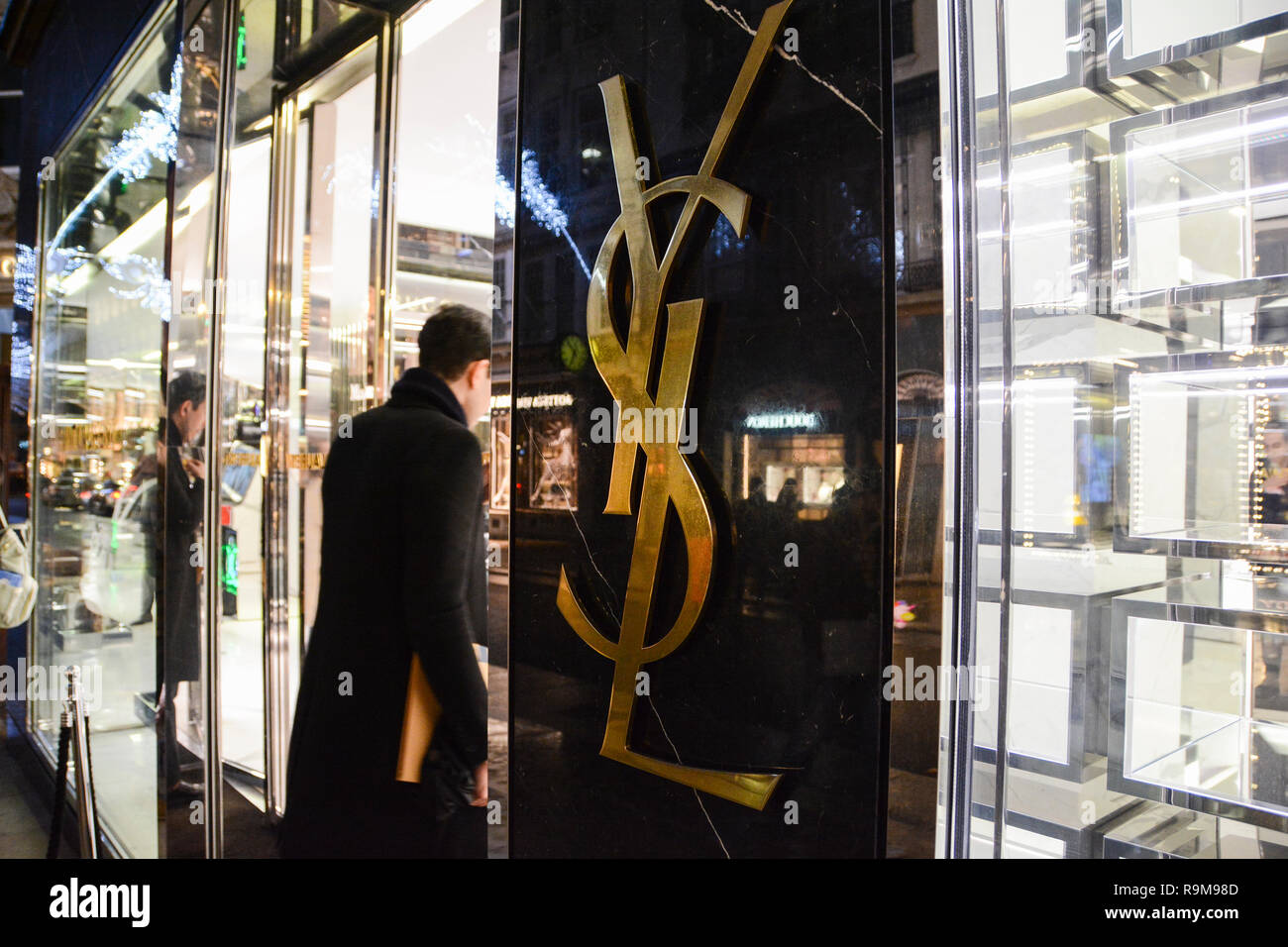 Yves Saint Laurent pour homme label in man's jumper Stock Photo