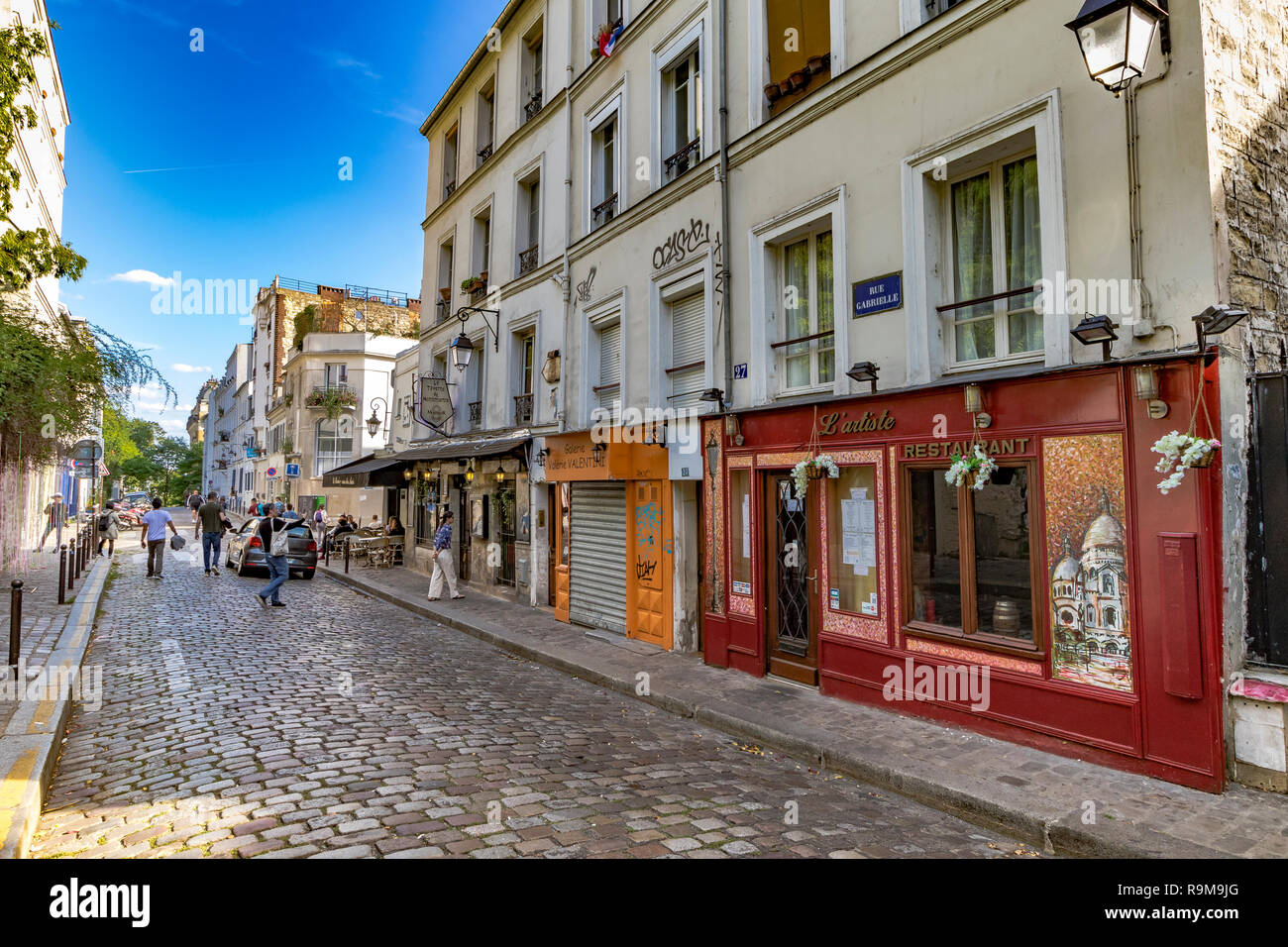 L'artiste restaurant on Rue Gabrielle a cobbled street in Montmartre ,Paris, France Stock Photo