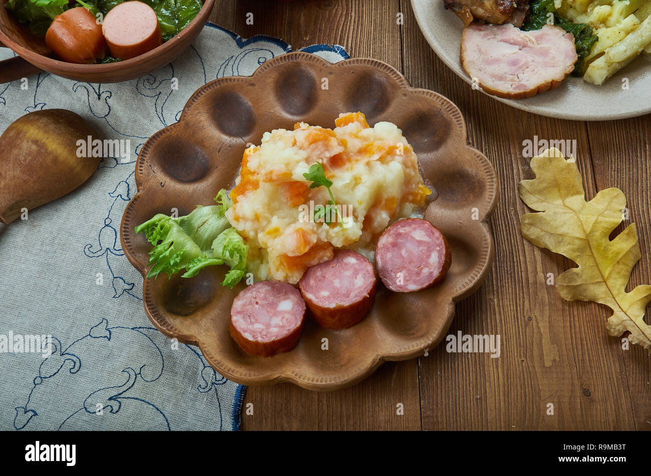 Hutspot Dutch, hochepot French or hotchpotch English, is a dish of boiled  and mashed potatoes, carrots and onions close up in the bowl on the table.  V Stock Photo - Alamy