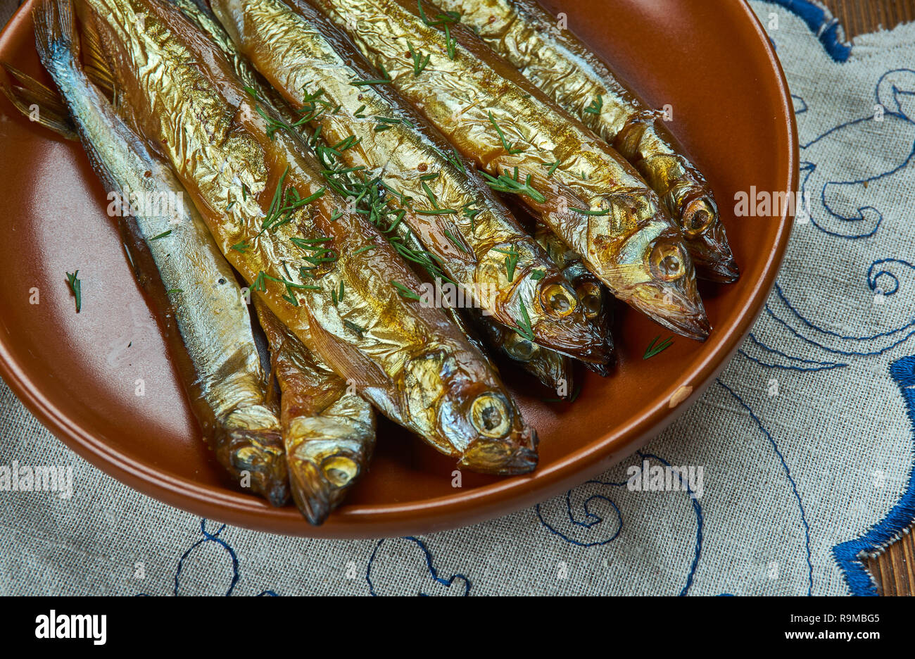 Bockling,  hot-smoked herring similar to the kipper and the bloater, Swedish homemade cuisine, Traditional assorted dishes, Top view. Stock Photo