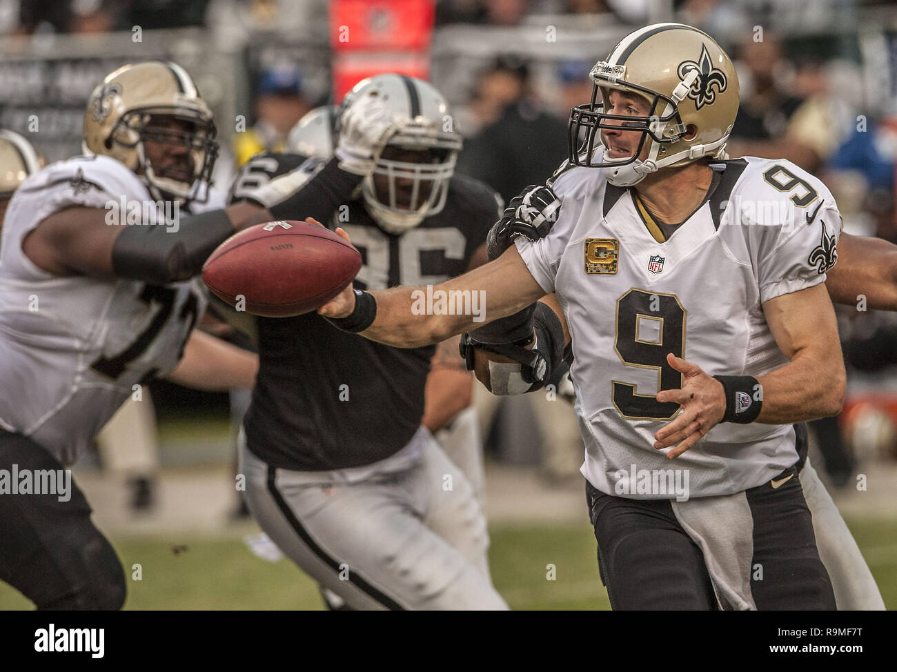 November 18, 2012 - Oakland, California, U.S - New Orleans Saints quarterback Drew Brees (9) makes quick pass before he is sacked on Sunday at O.co Coliseum in Oakland, CA.  The Saints defeated the Raiders 38-17. (Credit Image: © Al Golub/ZUMA Wire) Stock Photo
