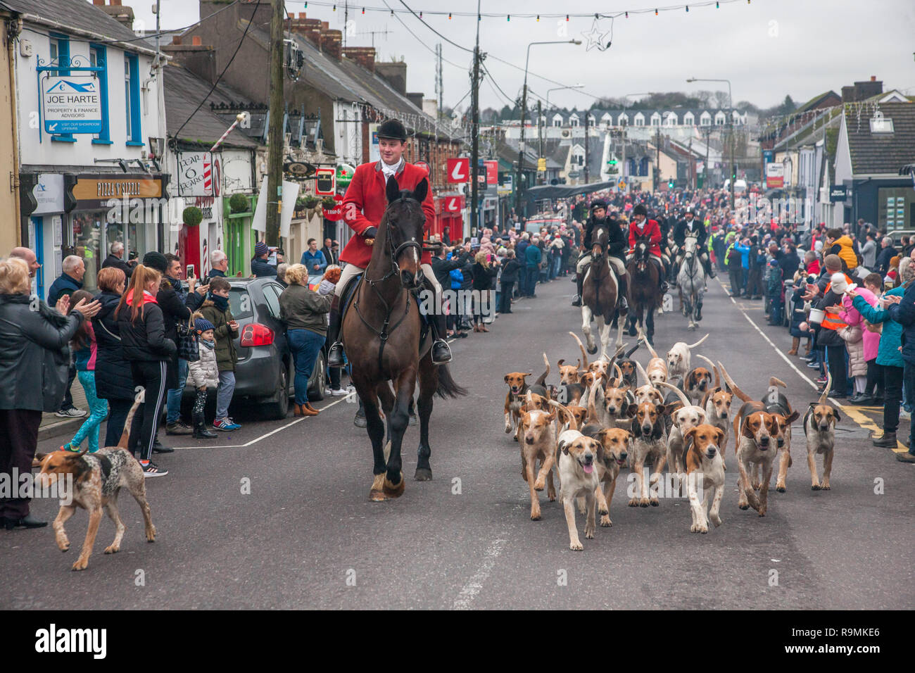 Carrigaline, Cork, Ireland. 26th December, 2018. Members of the South Union Hunt set off with their hounds up Main Street, Carrigaline, Co. Cork for their  traditional St Stephen's Day Hunt. Credit: David Creedon/Alamy Live News Stock Photo