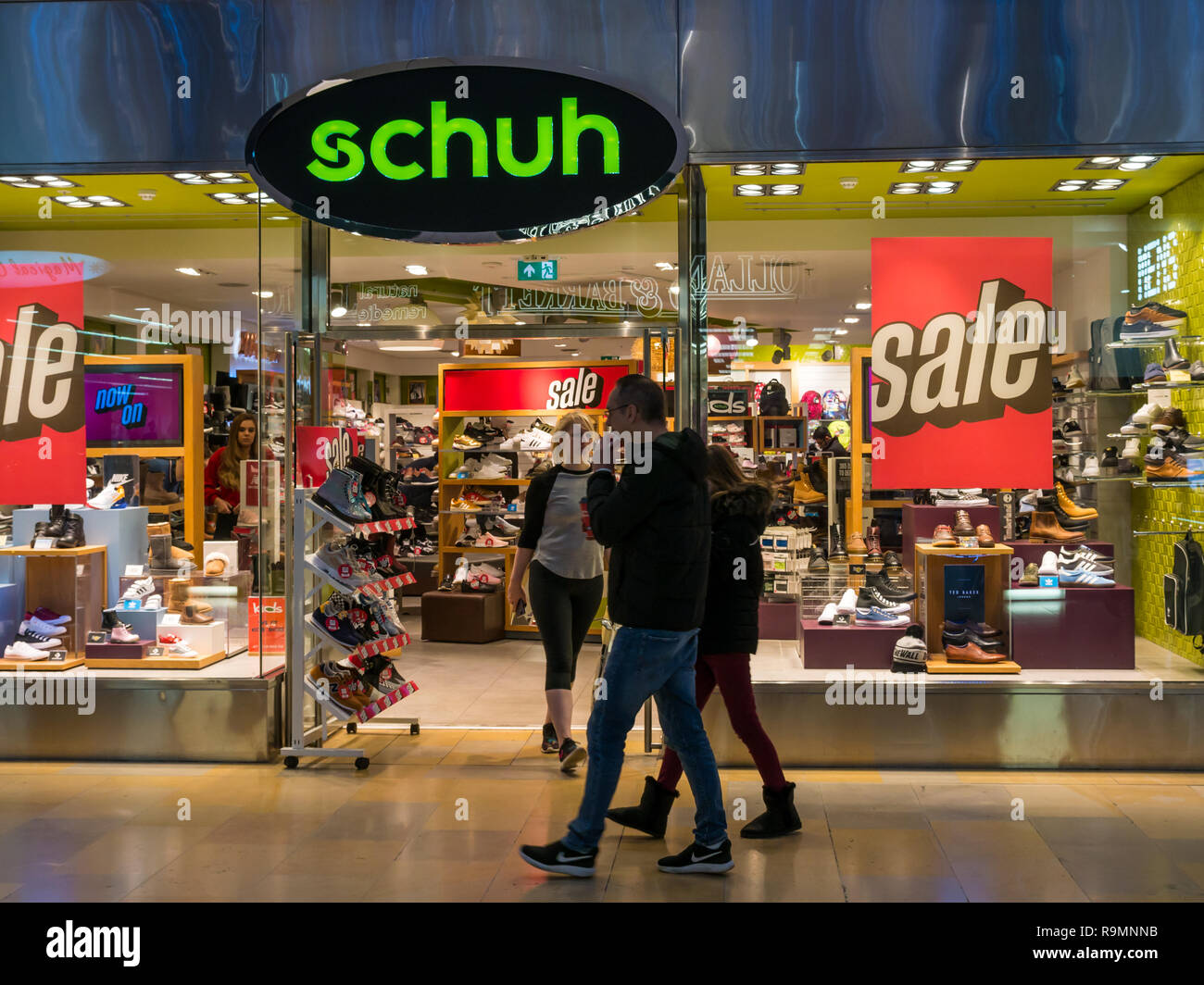 Ocean Terminal shopping centre, Leith, Edinburgh, Scotland, United Kingdom,  26th December 2018. Schuh shop front advertising a Boxing Day sale with  shoppers walking past the window display Stock Photo - Alamy