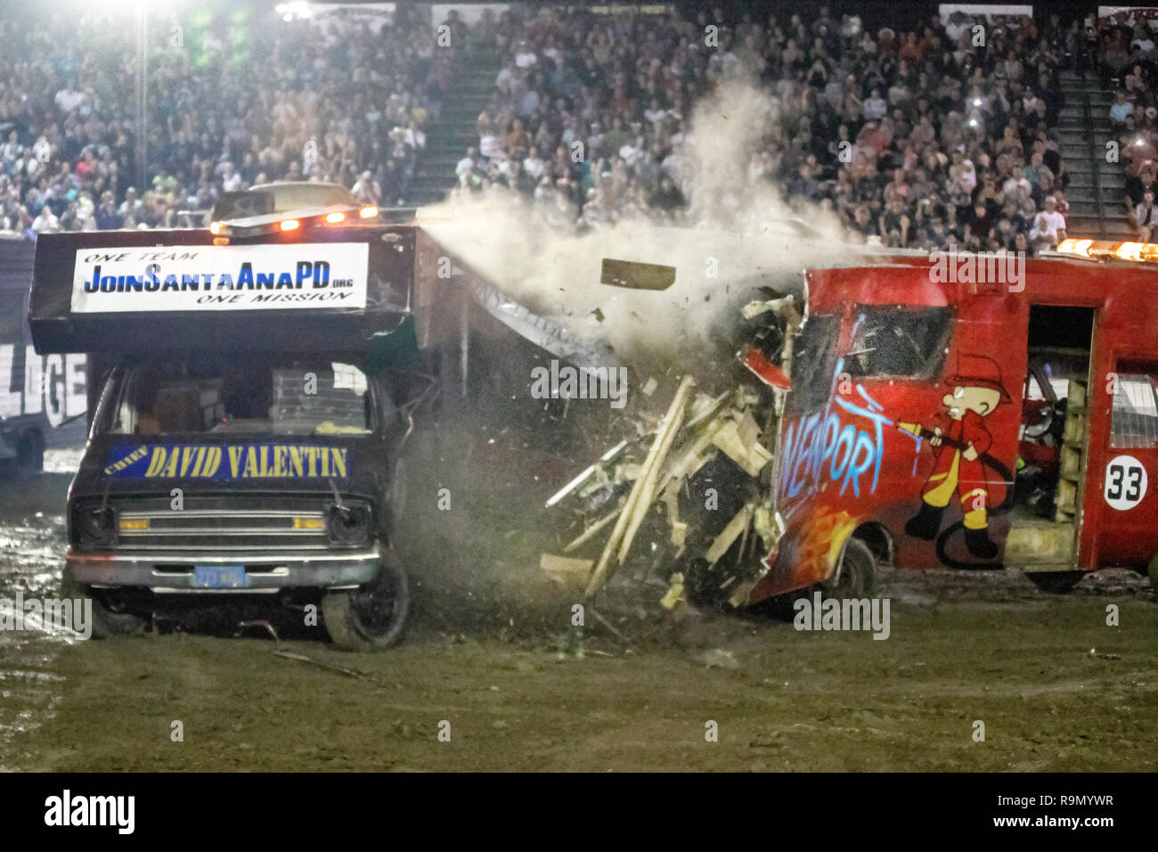 Motor homes crash in a night time demo derby at a Costa Mesa, CA
