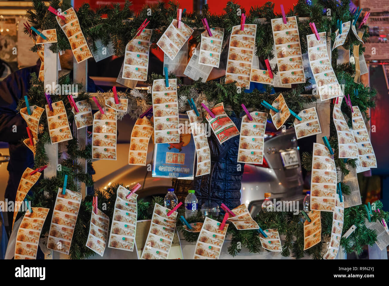 Street vendor selling Greek lottery payslips in Thessaloniki. Evening