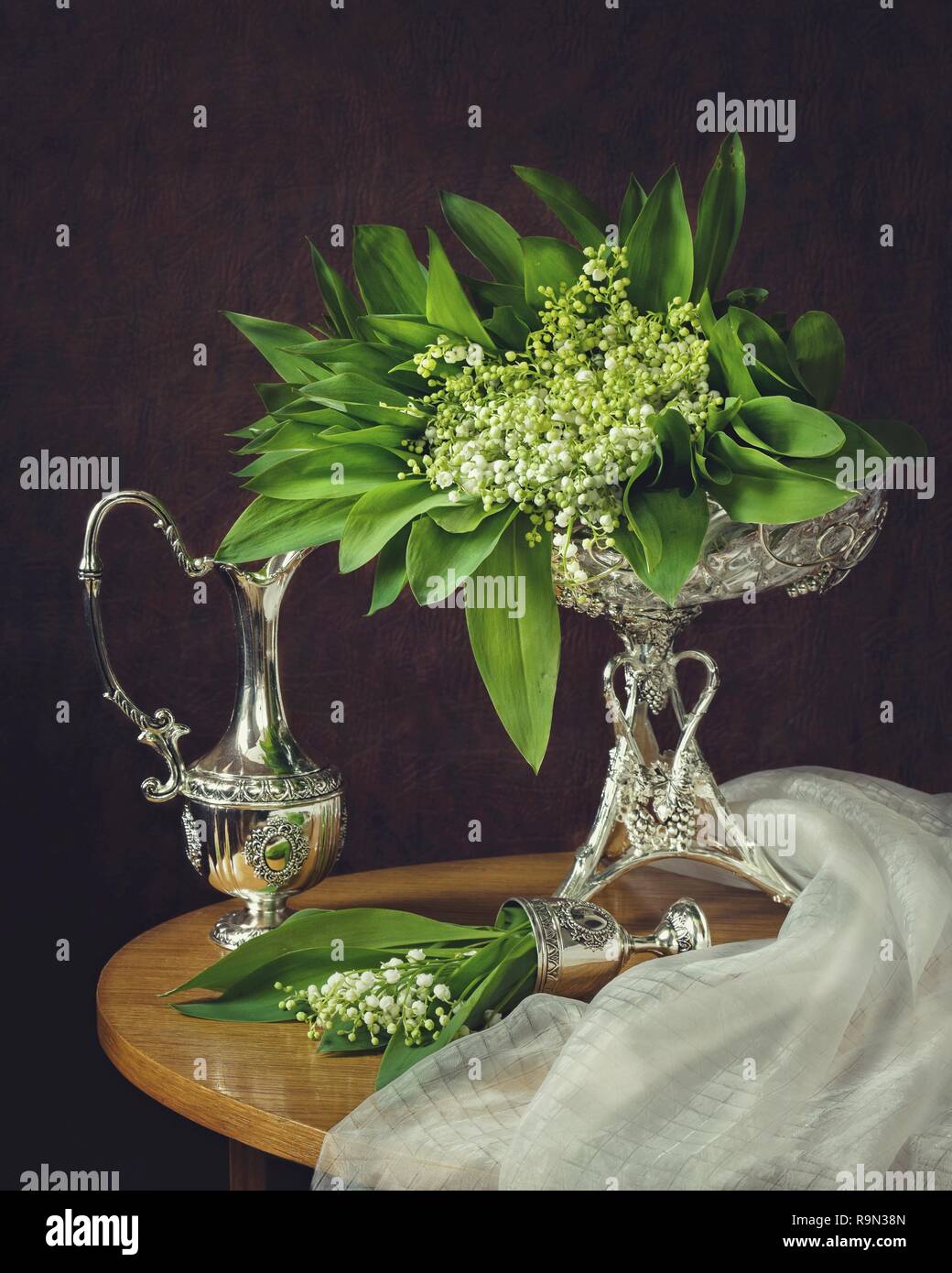 Still life with bouquet lily of the valley flowers Stock Photo - Alamy