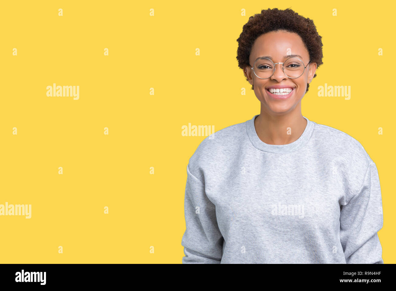 Young beautiful african american woman wearing glasses over isolated ...