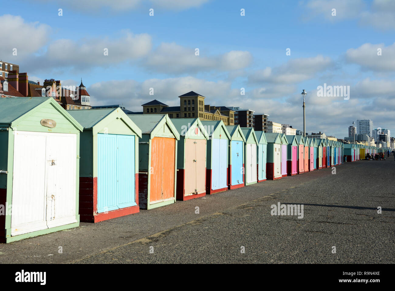 Colourful beach huts on Hove Promenade, Brighton, East Sussex, England, UK Stock Photo