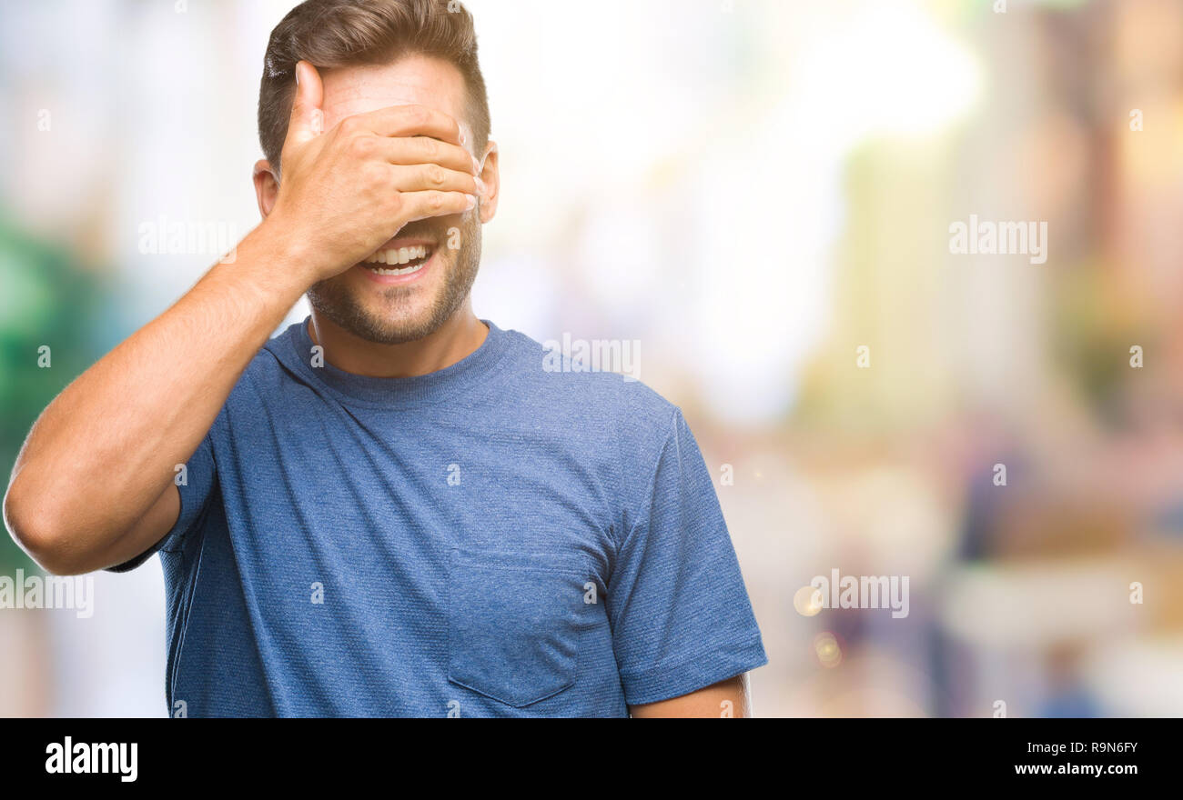 Young handsome man over isolated background smiling and laughing with ...