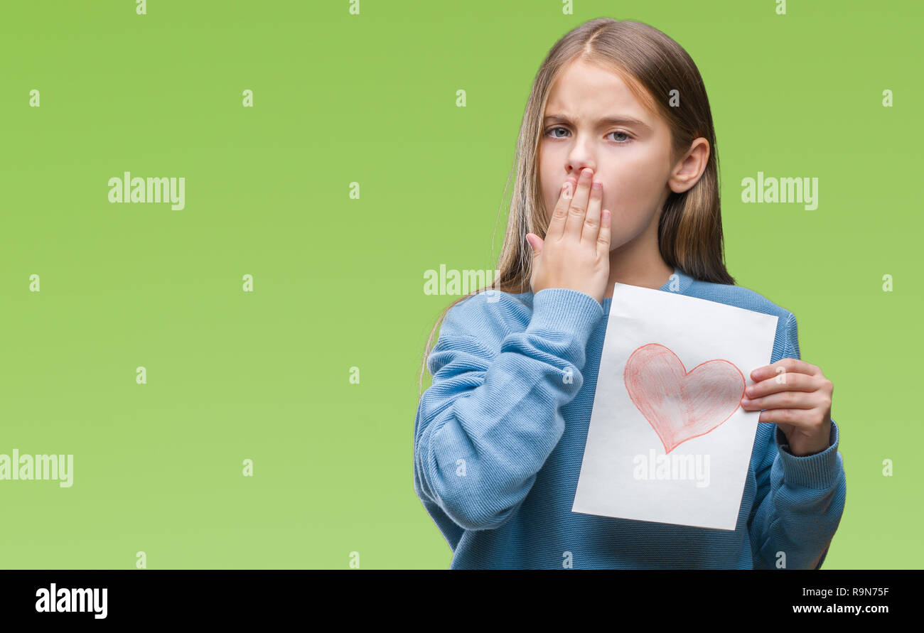 Young beautiful girl giving mother father day card with red heart over isolated background cover mouth with hand shocked with shame for mistake, expre Stock Photo