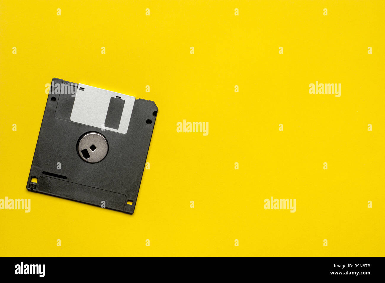 Floppy disk 3.5 inch nostalgia on yellow color background for creative design, printing, gift card, flyer, magazine Stock Photo