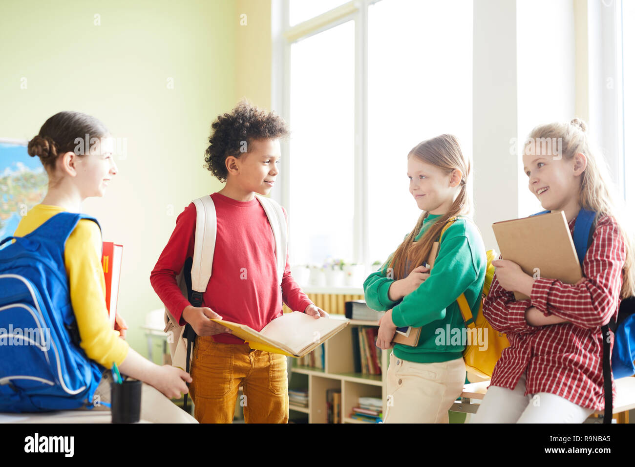 Elementary students discussing school project Stock Photo