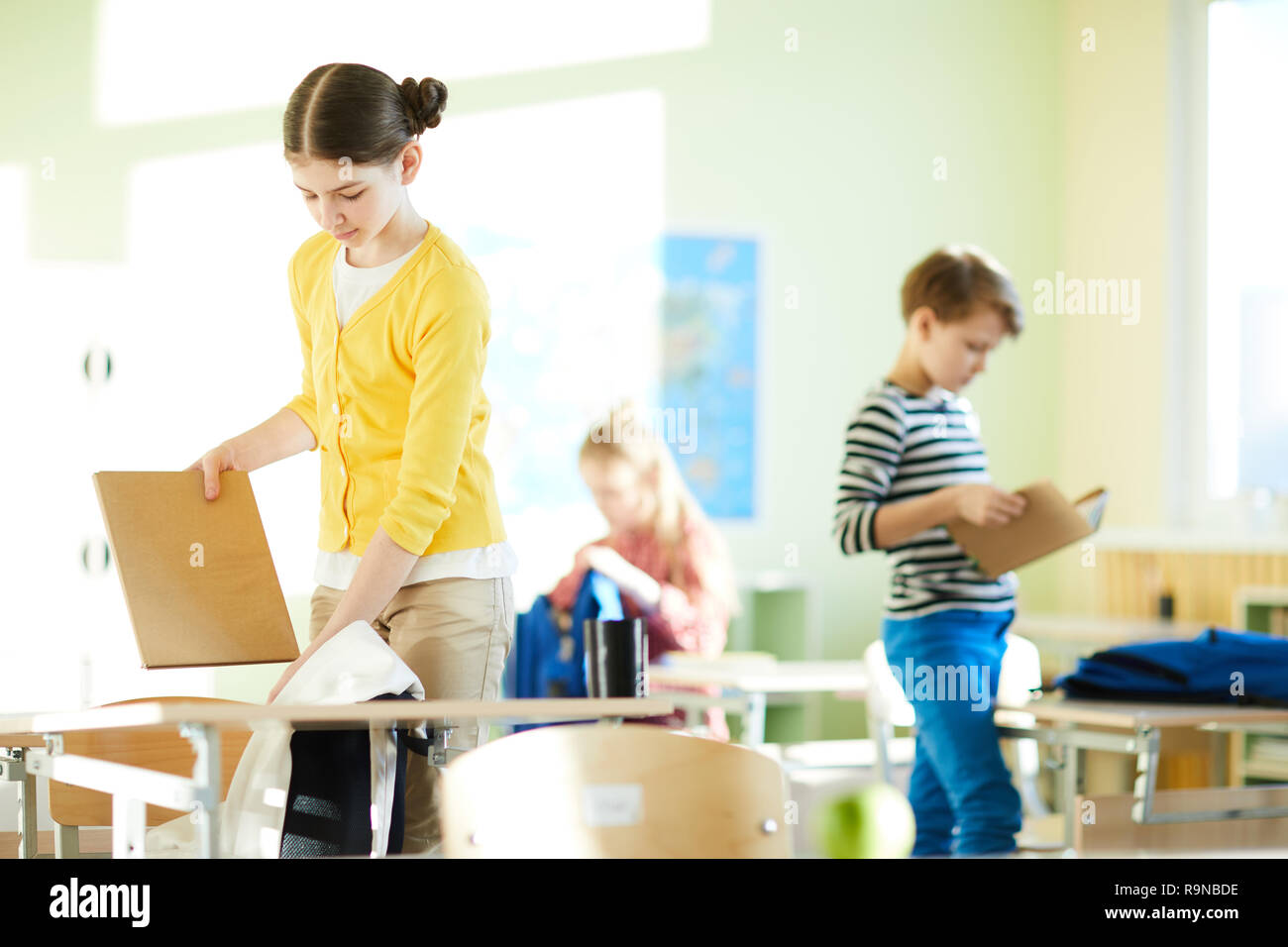 Packing satchels after class Stock Photo