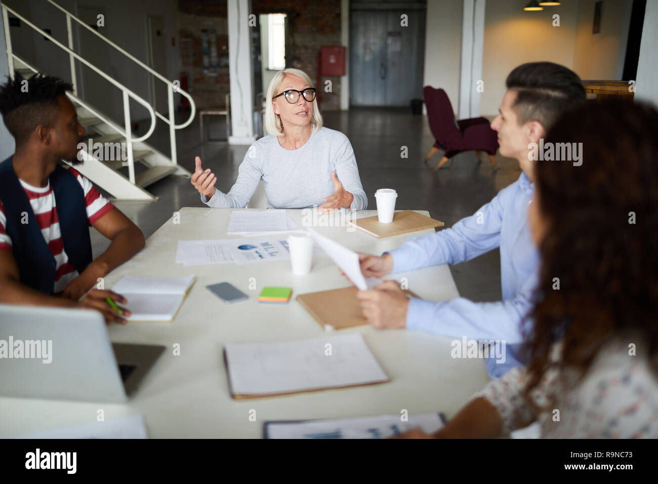 Female leader and her team Stock Photo - Alamy