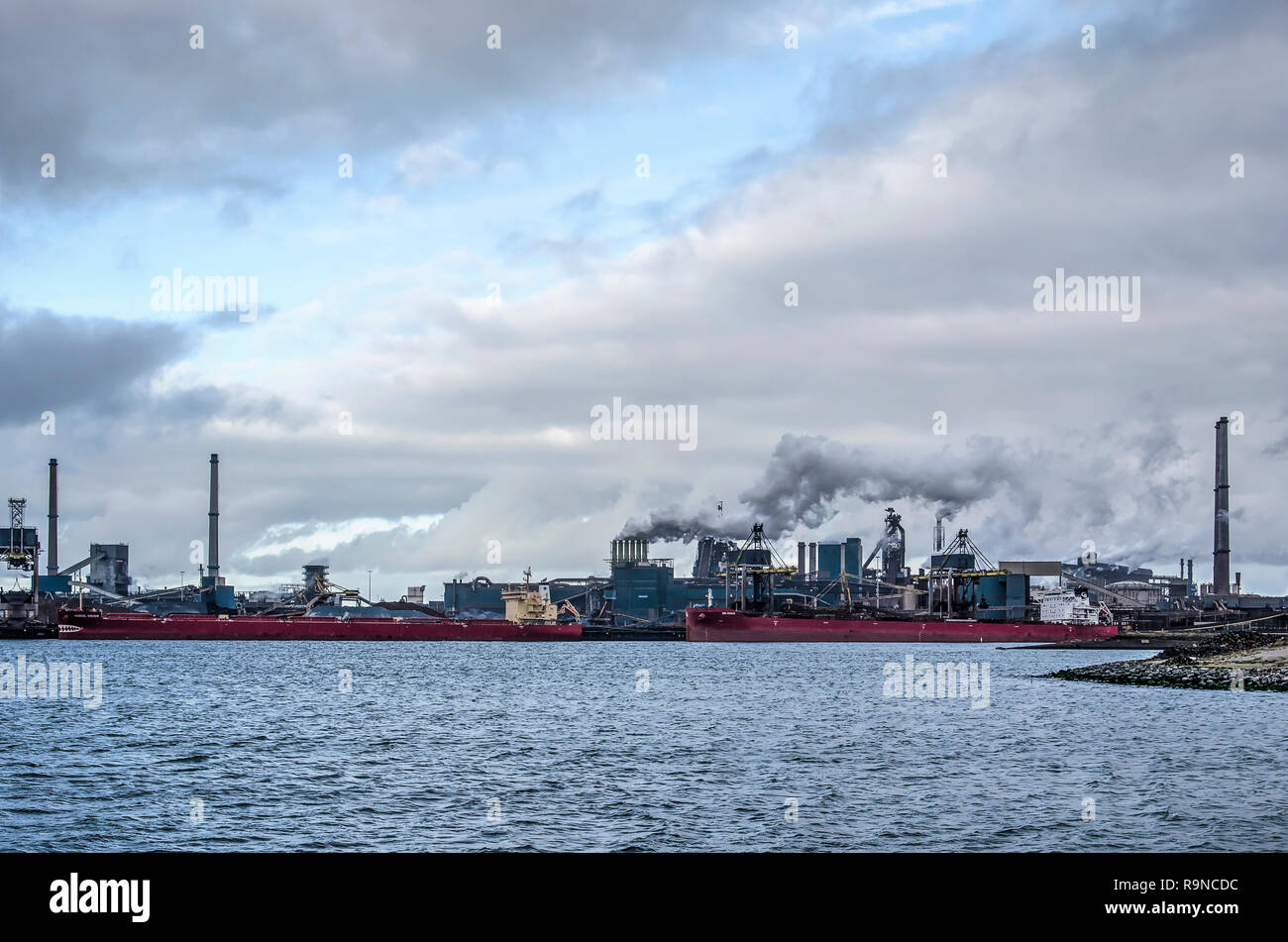 IJmuiden, The Netherlands, December 22, 2018: view across Northsea Canal towards the Tata steelworks under a dramatic sky Stock Photo