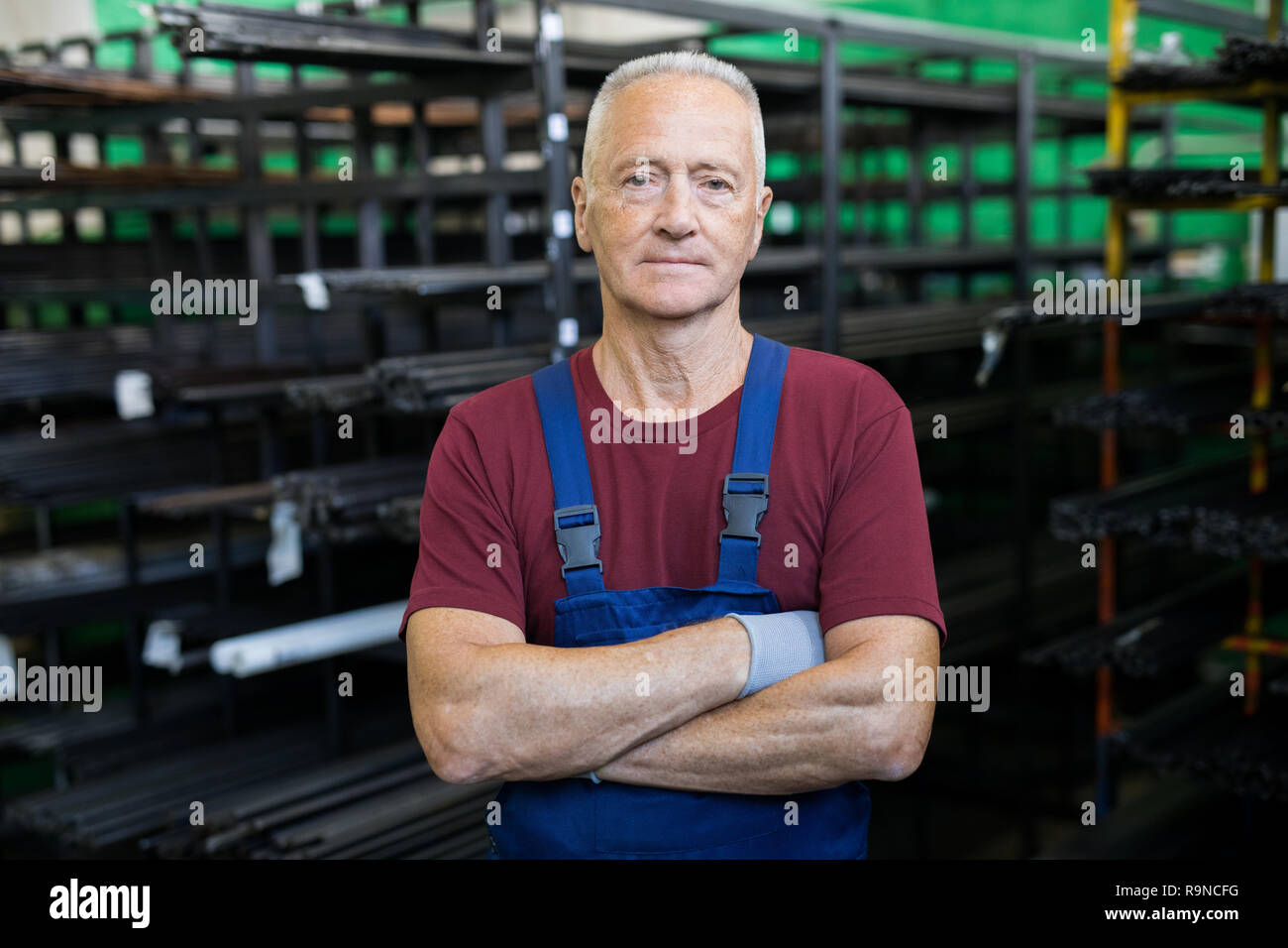 Foreman standing in factory Stock Photo