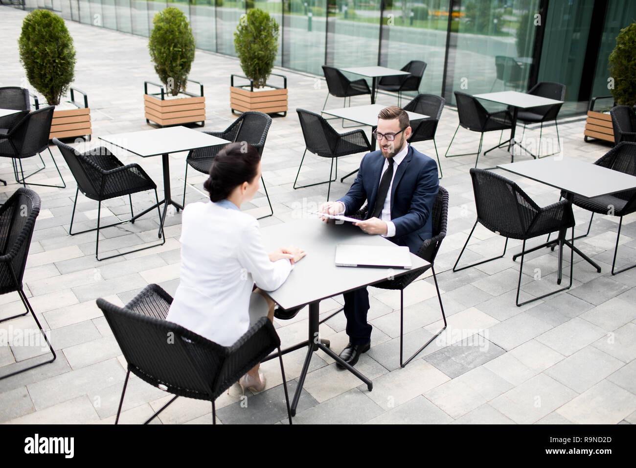 Modern businesspeople communicating on terrace Stock Photo