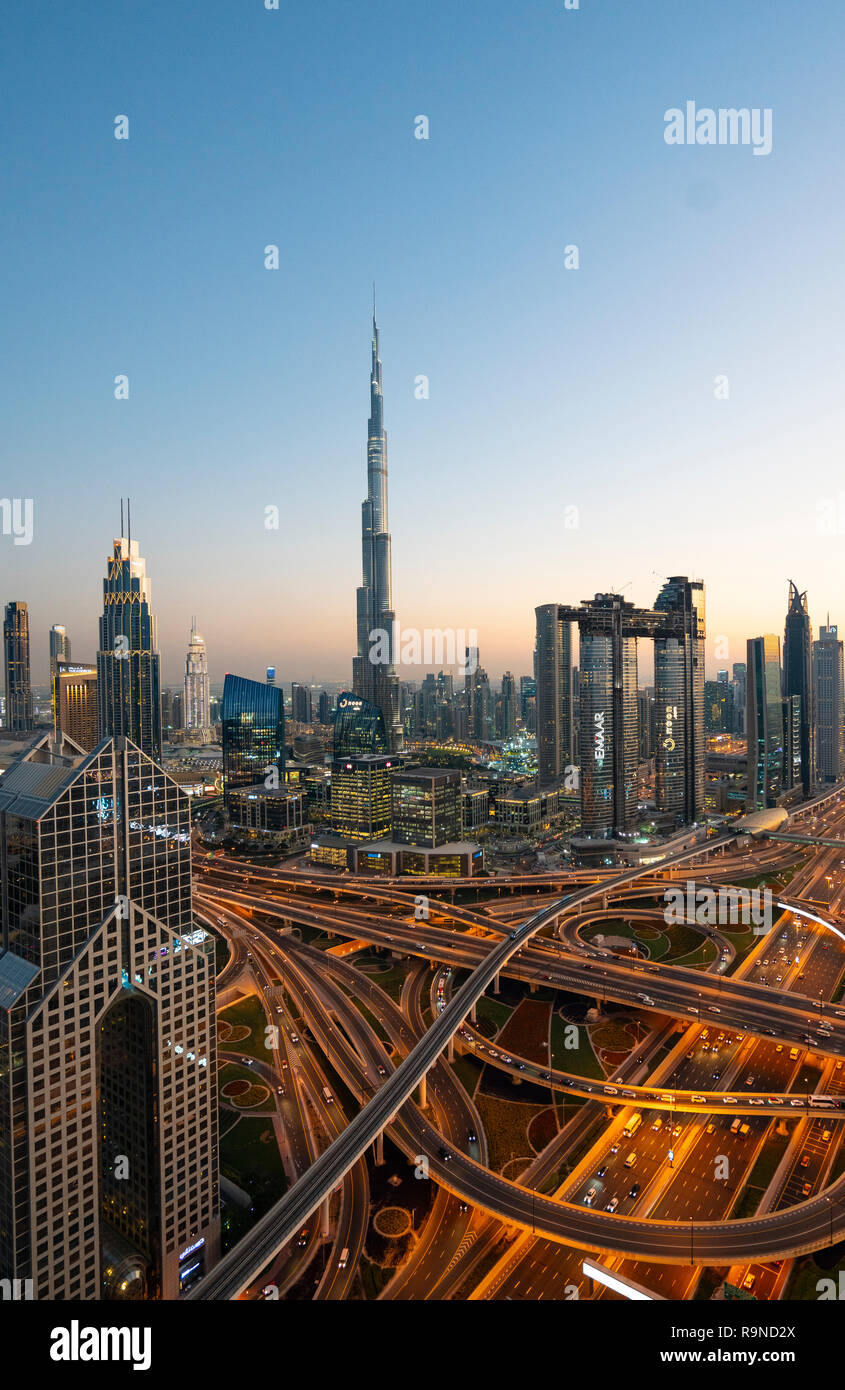 Skyline of Dubai, Sheikh Zayed Road and Burj Khalifa skyscraper at dusk in Dubai, United Arab Emirates Stock Photo