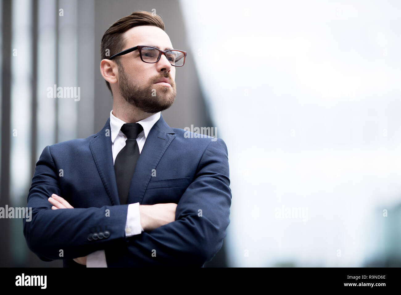 Stylish man crossing hands Stock Photo Alamy