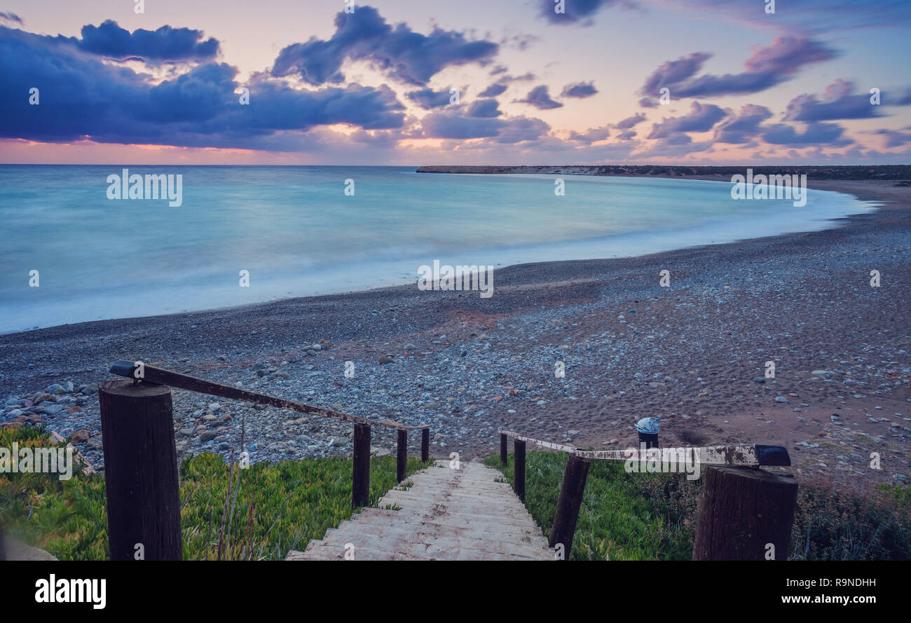 Wooden path down to the beach and ocean. Walkway and stairs through ...
