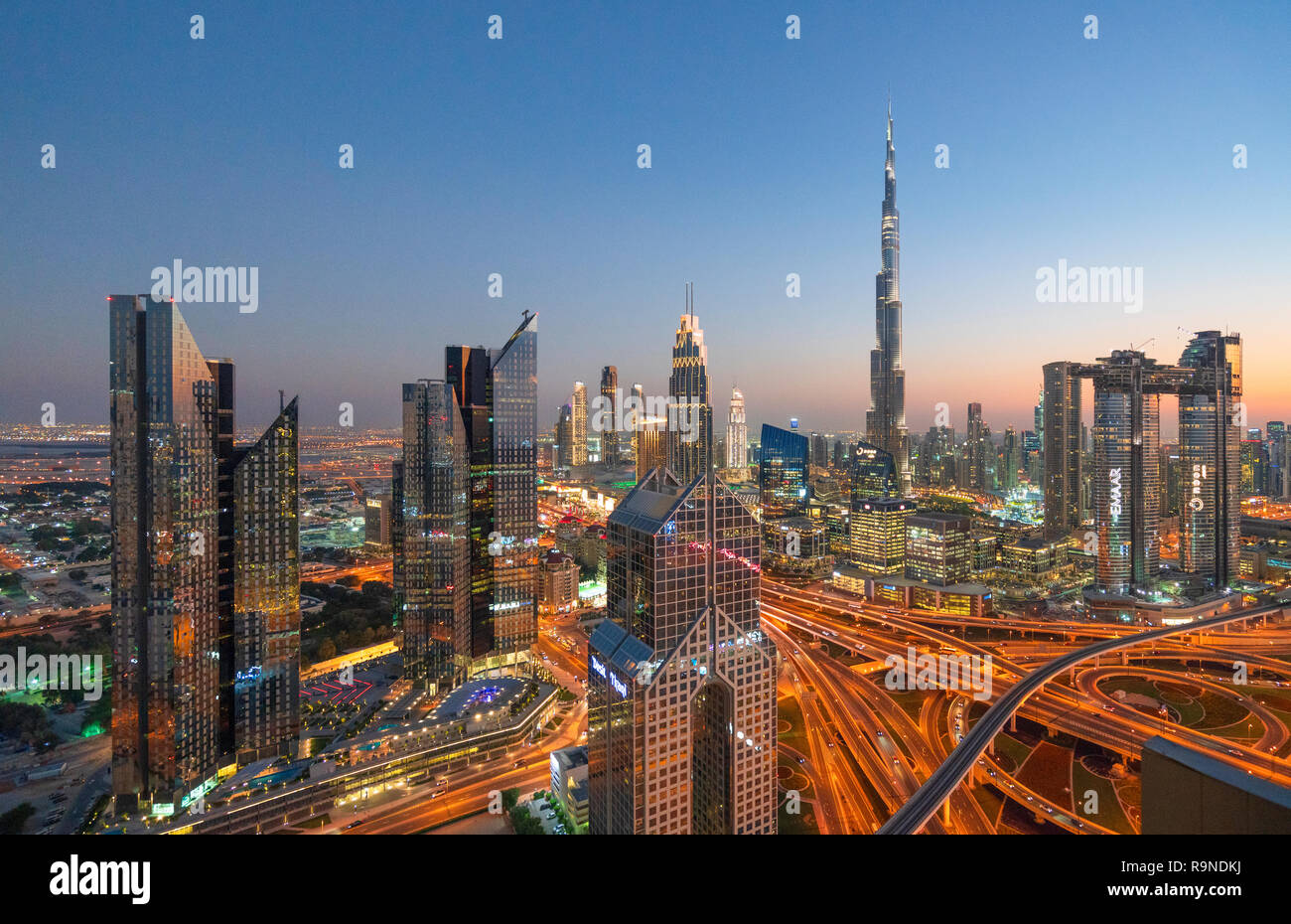 Skyline of Dubai, Sheikh Zayed Road and Burj Khalifa skyscraper at dusk in Dubai, United Arab Emirates Stock Photo
