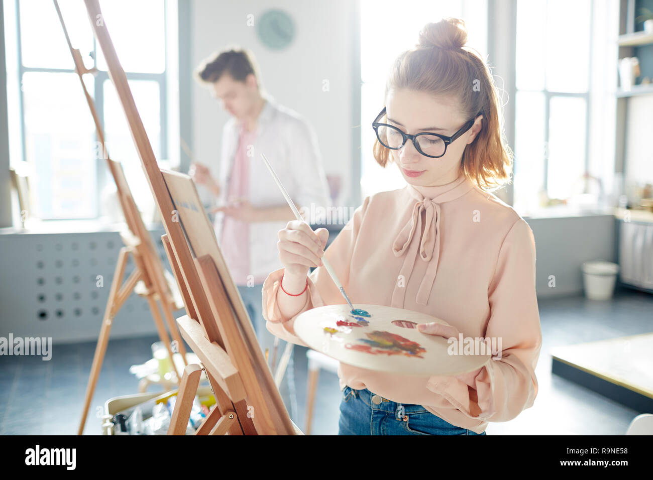 Student with palette Stock Photo - Alamy