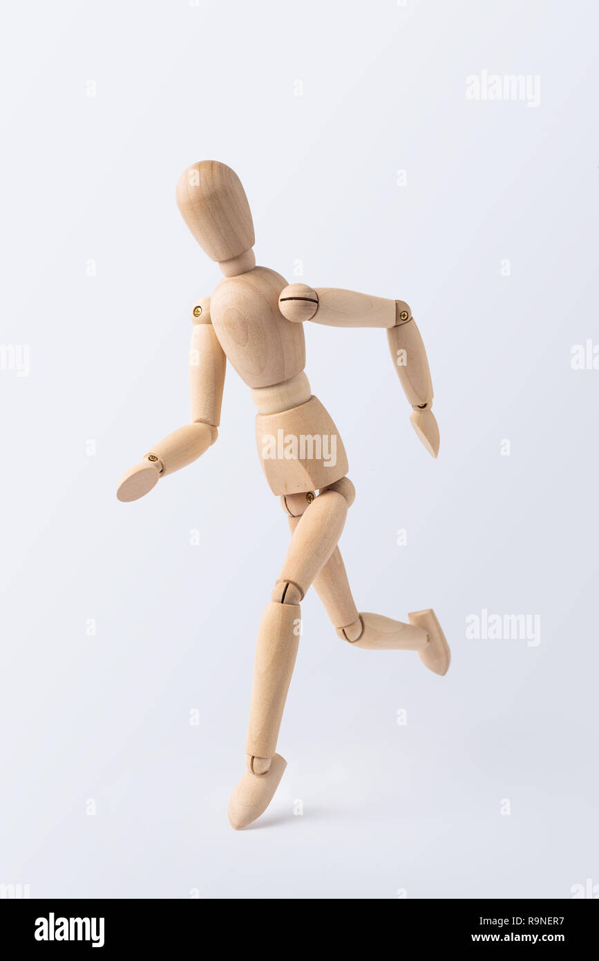 Wooden Running Mannequin Isolated On White High-Res Stock Photo