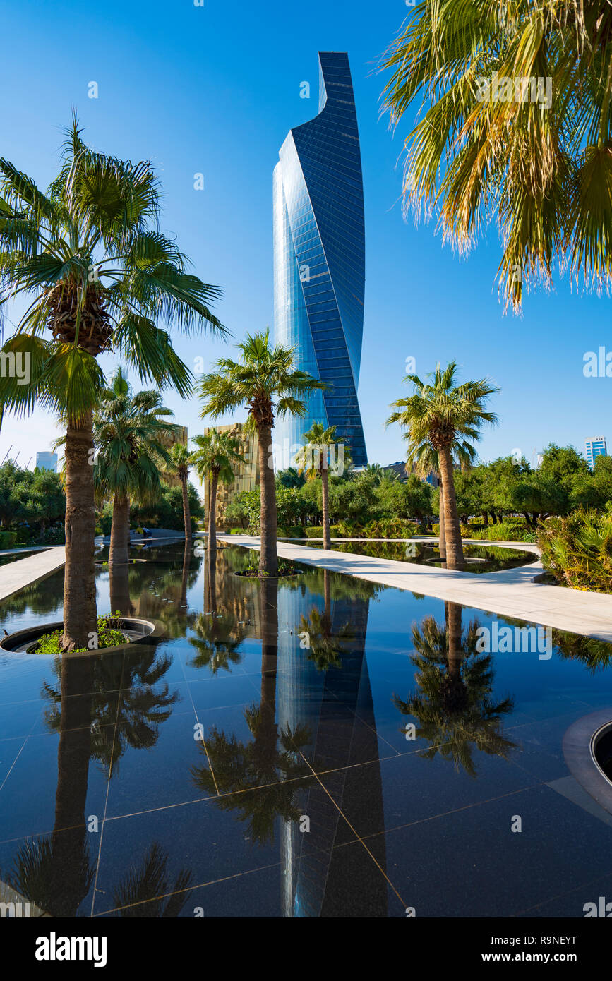 Palm trees reflected inn pond at  Al Shaheed Park in Kuwait City,Kuwait, Middle East Stock Photo