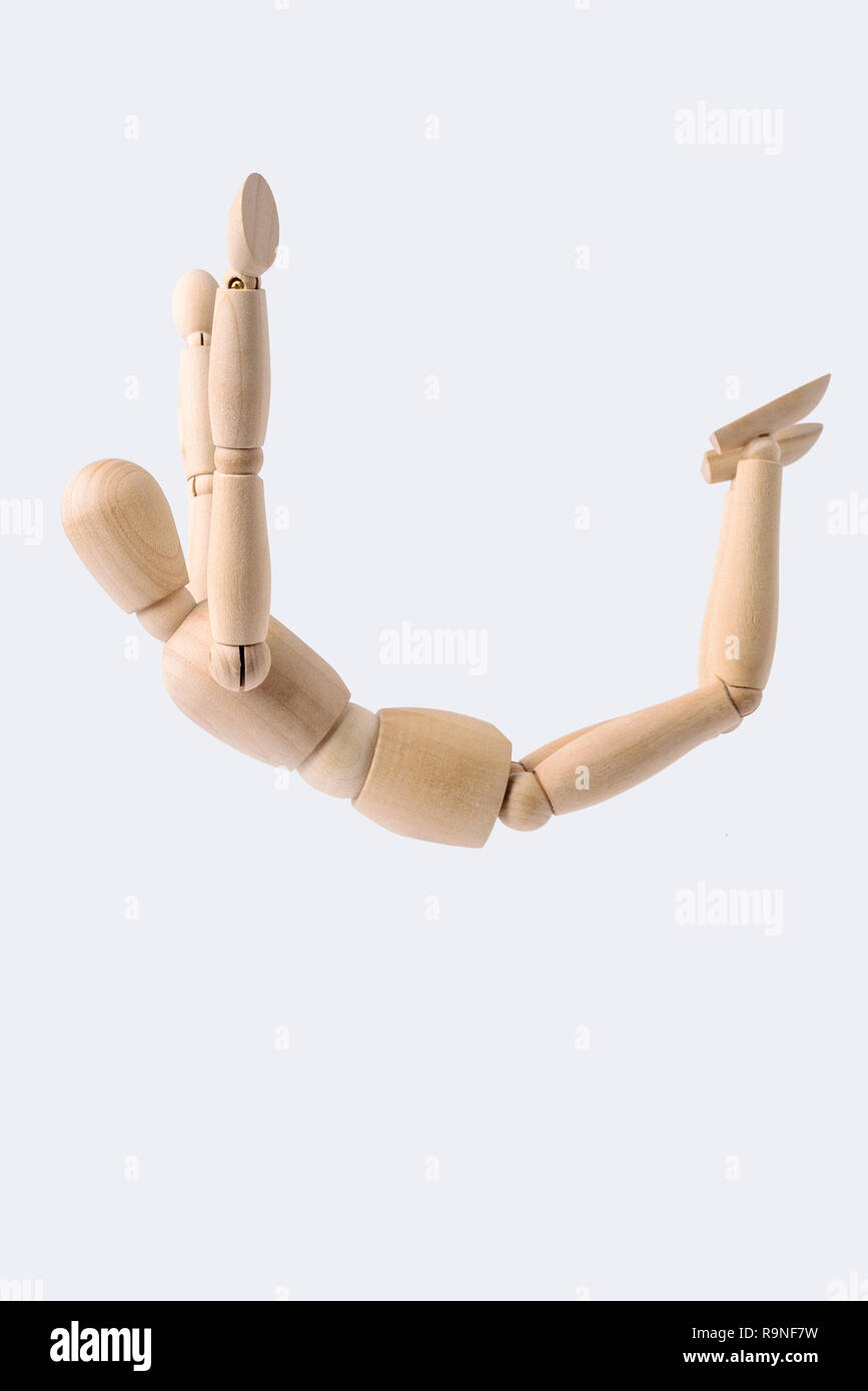 Business and design concept - free falling wooden mannequin isolated on white background Stock Photo