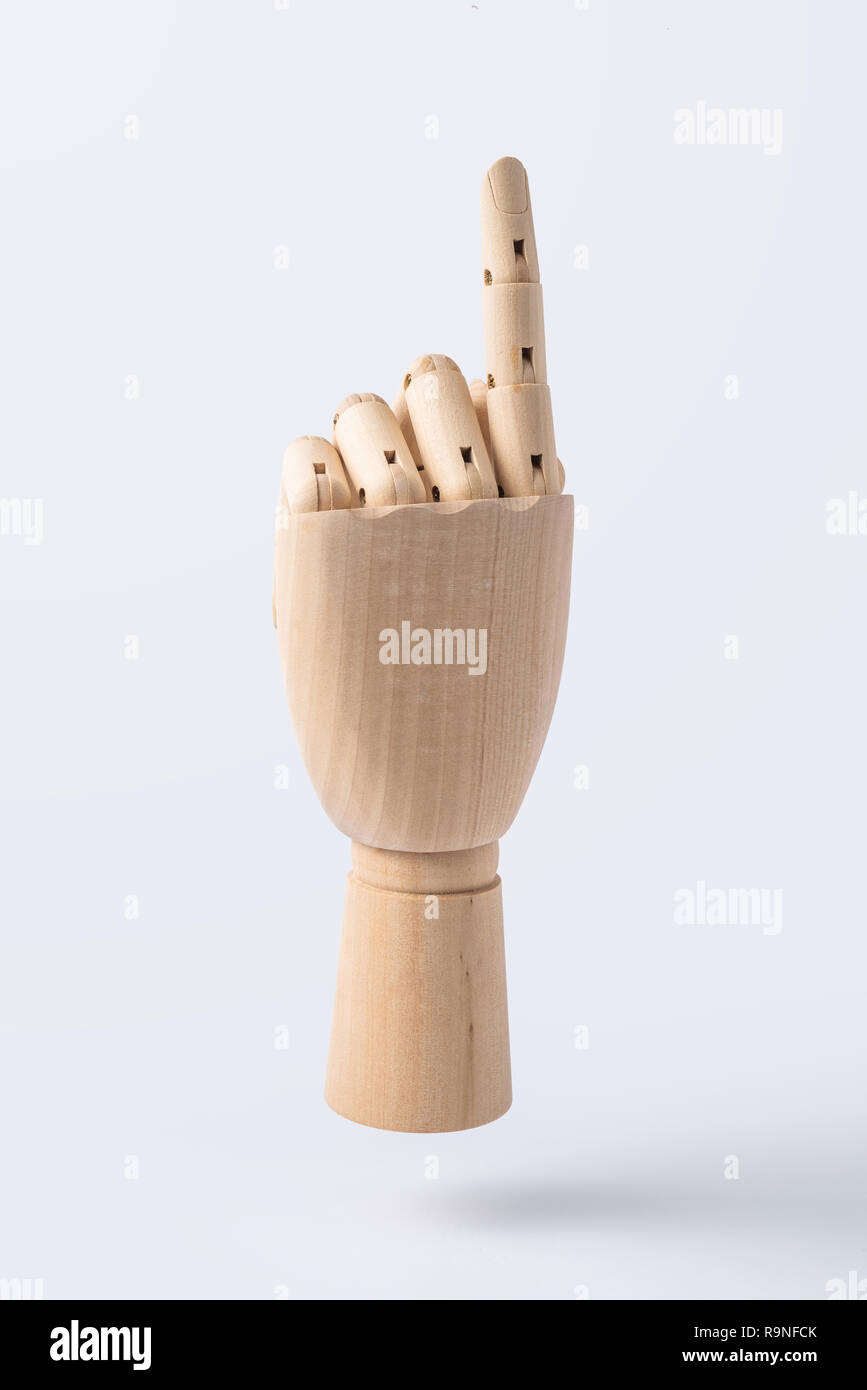 Business and design concept - wooden hand with number 1 posture isolated on white background Stock Photo
