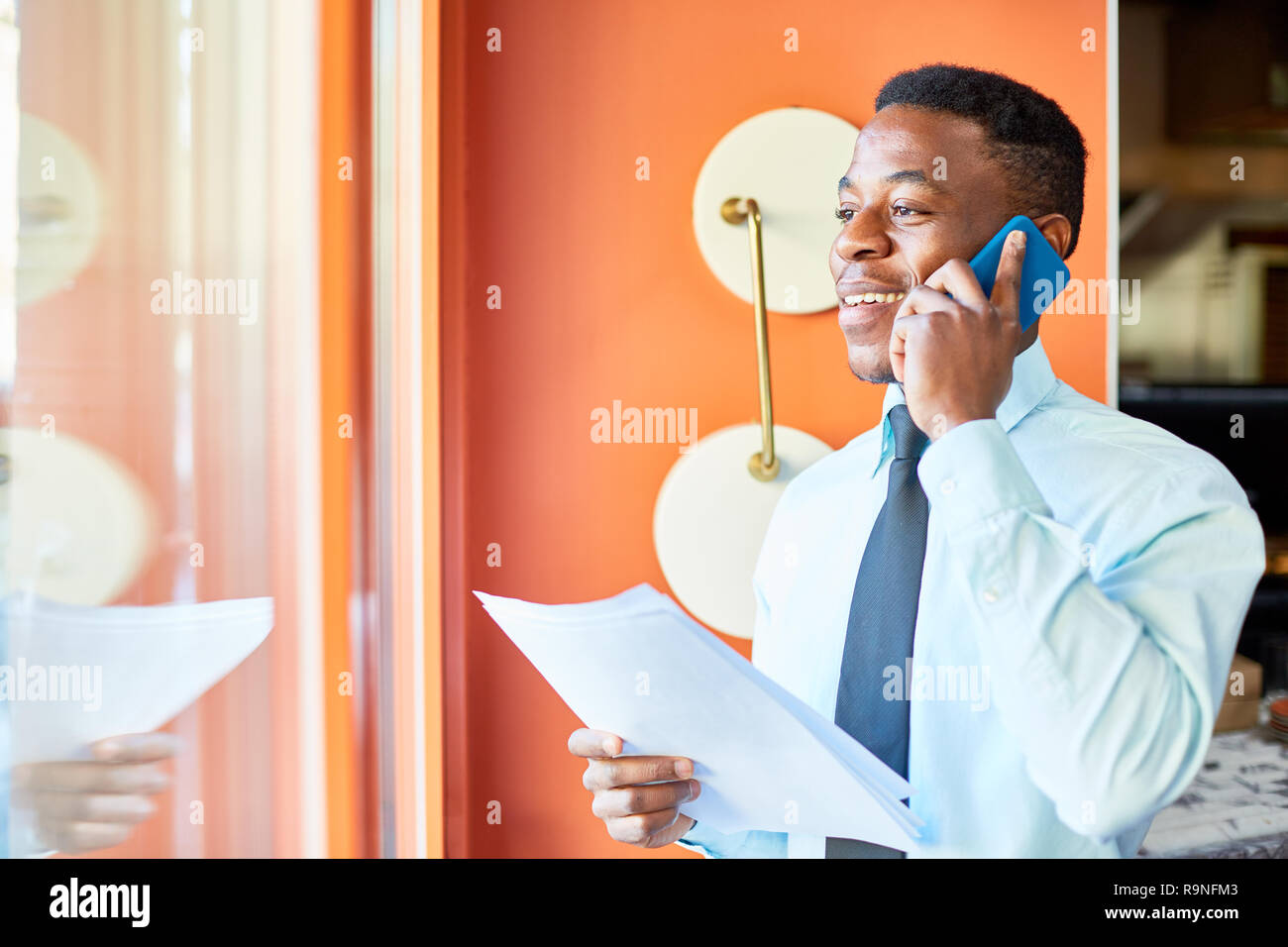 Working with client by phone Stock Photo