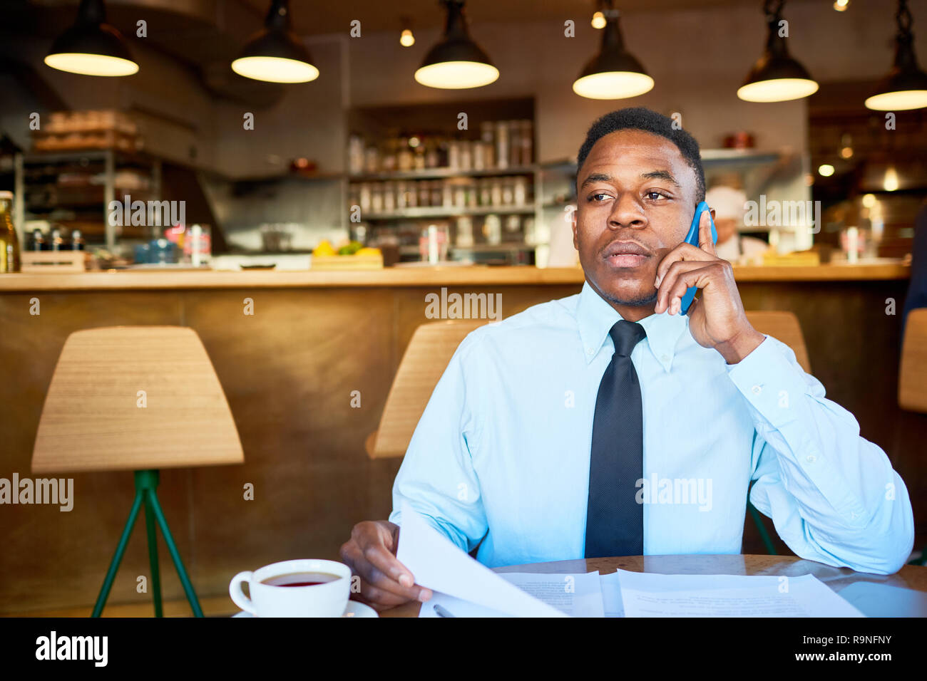 Calling in cafe Stock Photo