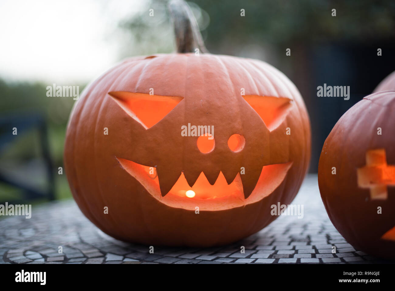 Pumpkin carvings are often called Jack o Lanterns and are popular  decorations at Halloween Stock Photo - Alamy