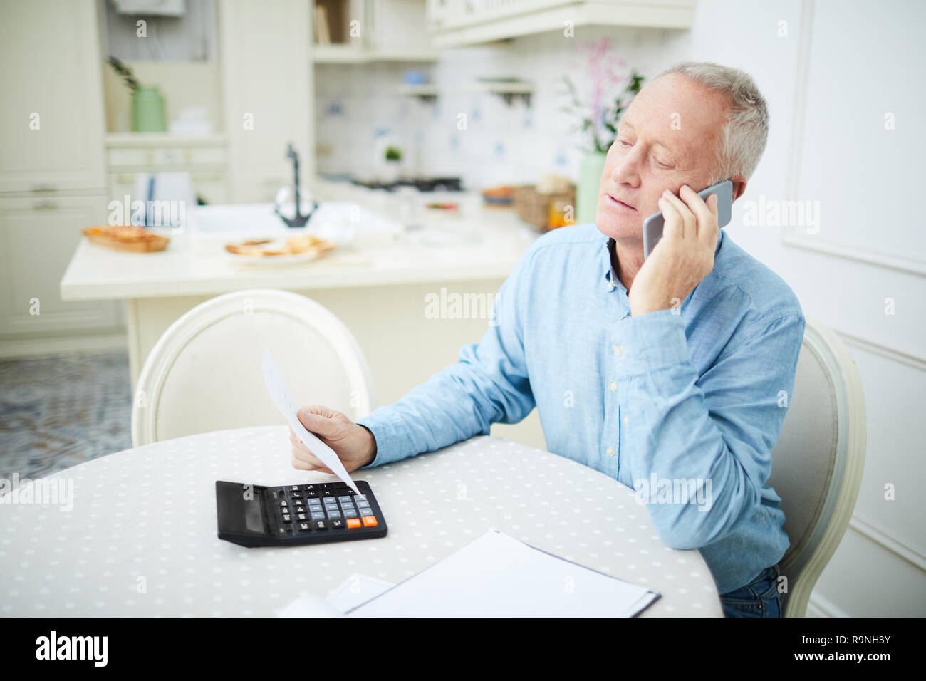 Pensioner calling Stock Photo