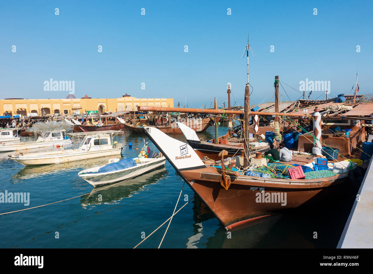 Traditional dhow fishing boasts in fishing harbour at Nag'aat Al Kout in Fahaheel , Kuwait, Middle East. Stock Photo