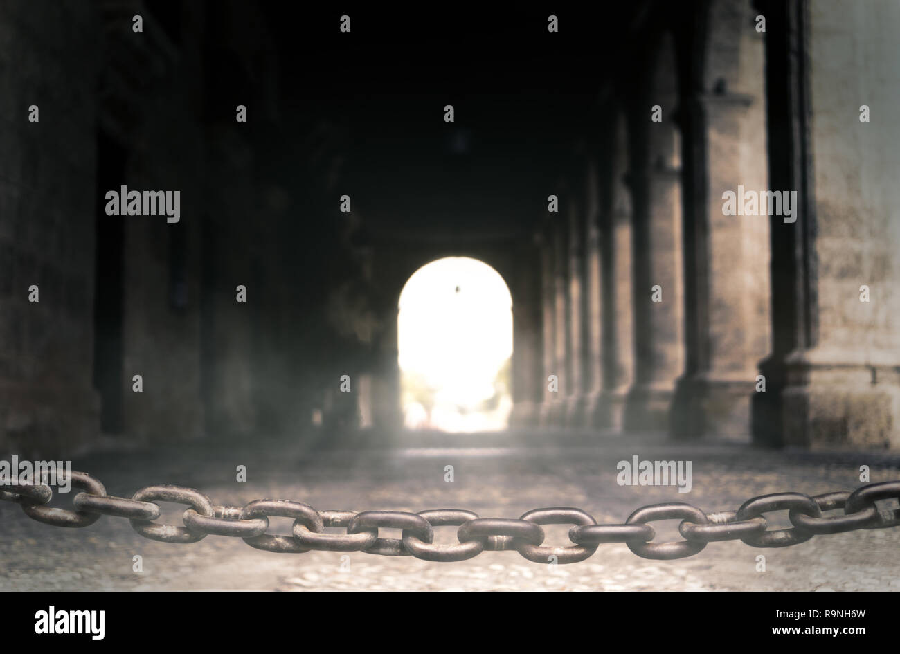 Iron Chain Locking Up A Historical Hallway With Pillars Back Light Glow And Dust Round Up The Scene Stock Photo Alamy