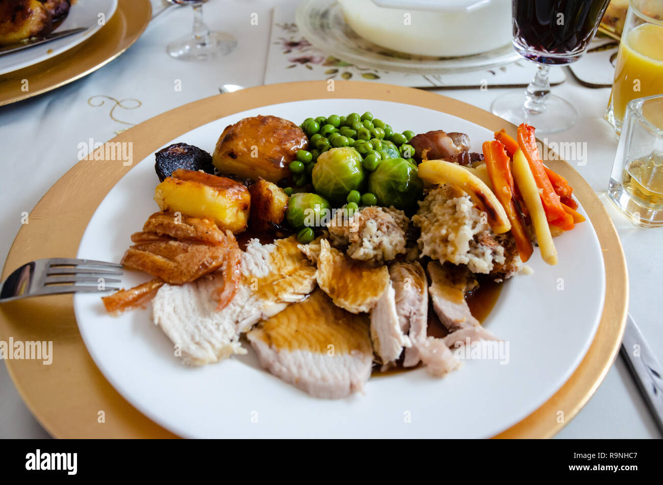 A Close Up View Of A Christmas Dinner Of Roast Chicken And Pork With Roast Potatoes Gravy And Vegetables Stock Photo Alamy