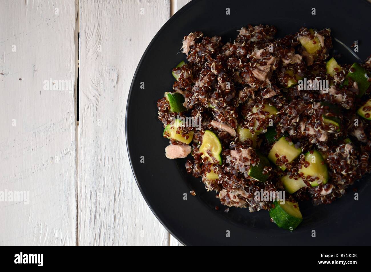 Healthy plate red quinoa with zucchini and tuna, complete dish with all macronutrients Stock