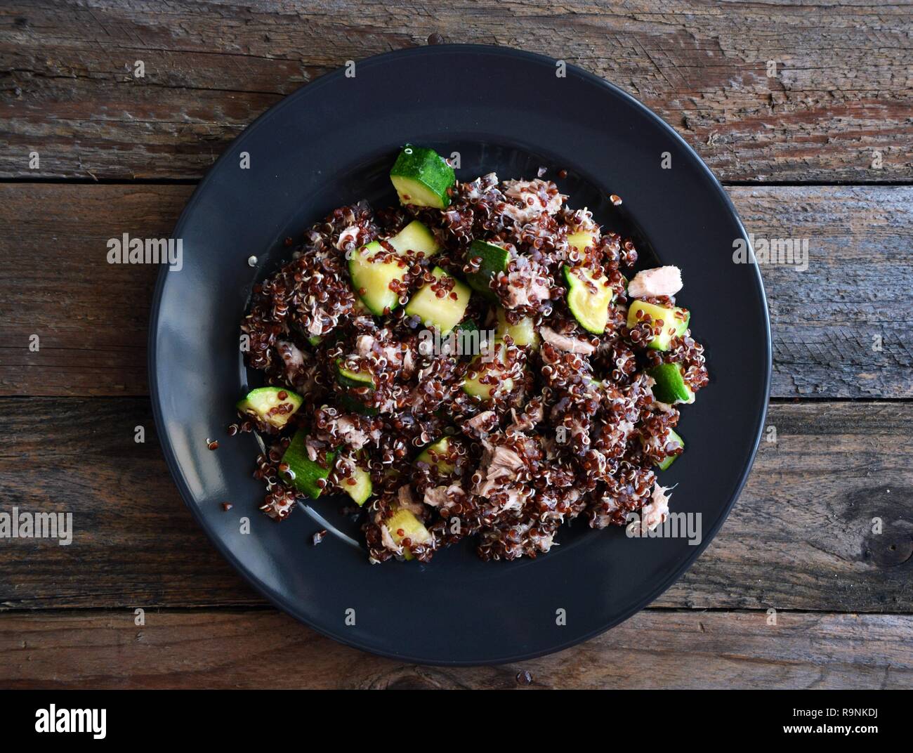 Healthy plate red quinoa with zucchini and tuna, complete dish with all macronutrients Stock