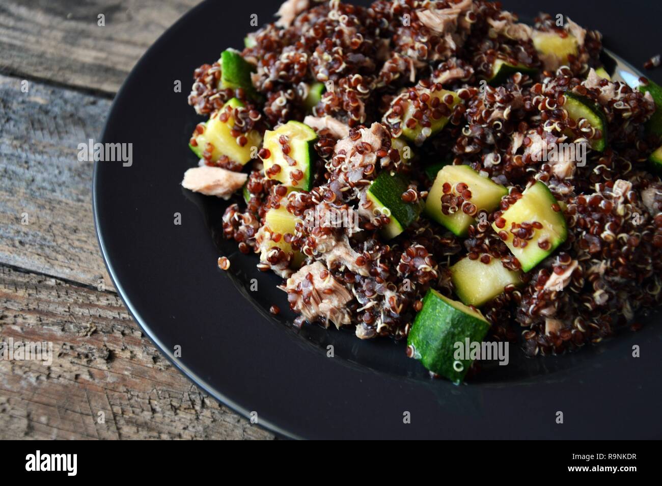 Healthy plate red quinoa with zucchini and tuna, complete dish with all macronutrients Stock