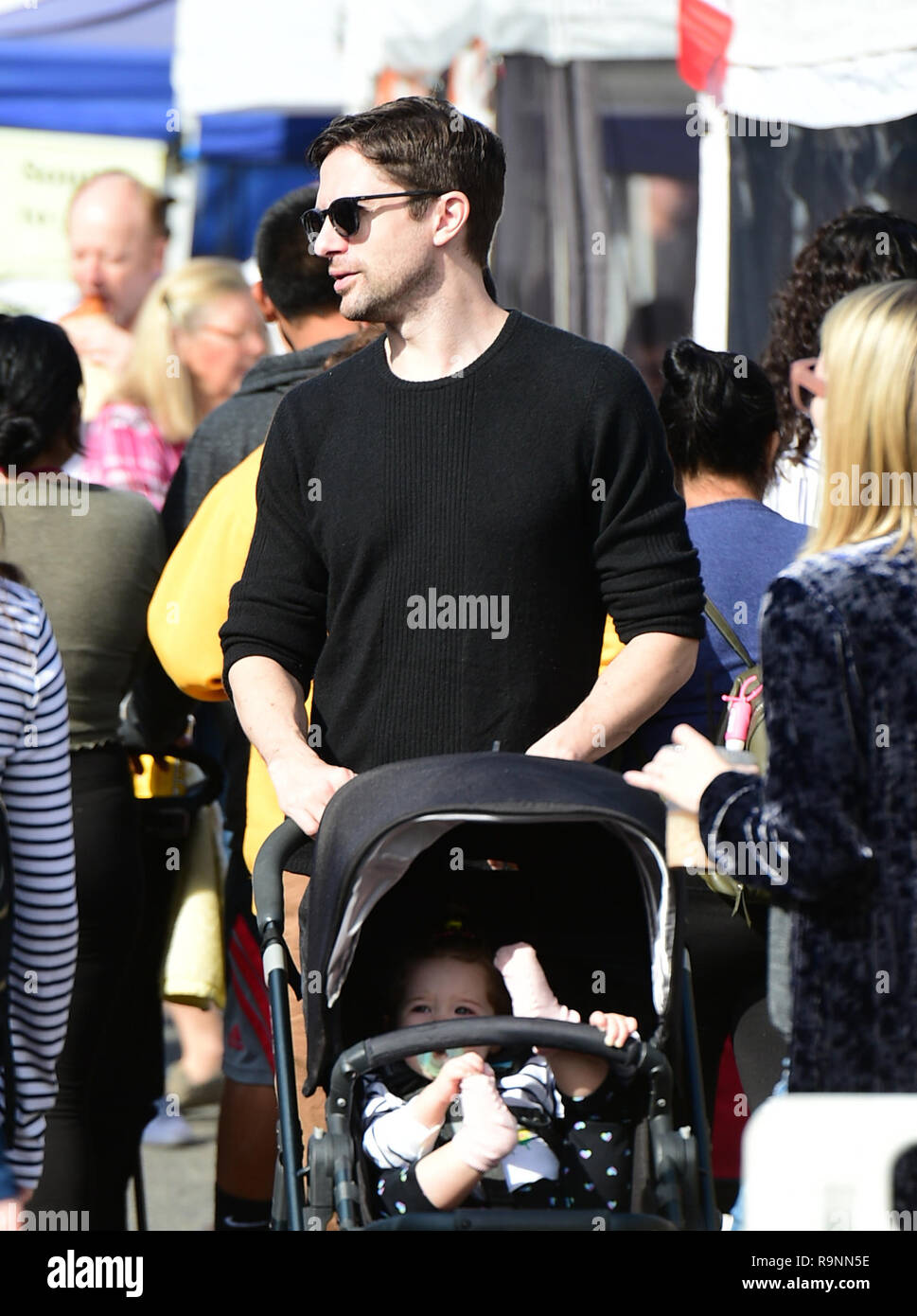 Topher Grace goes to the Farmers Market with his wife and their baby daughter Mabel Jane Grace